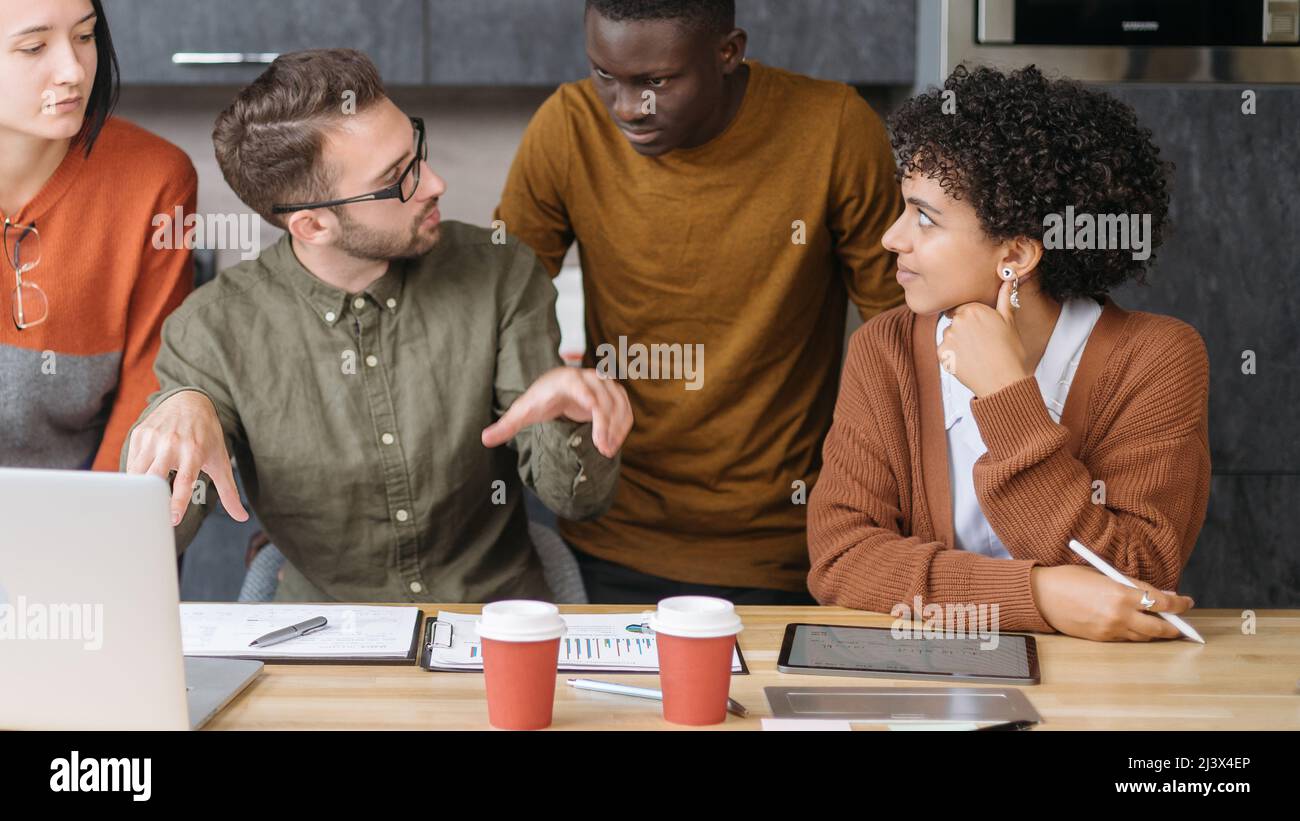 business man explaining something to his colleagues . Stock Photo