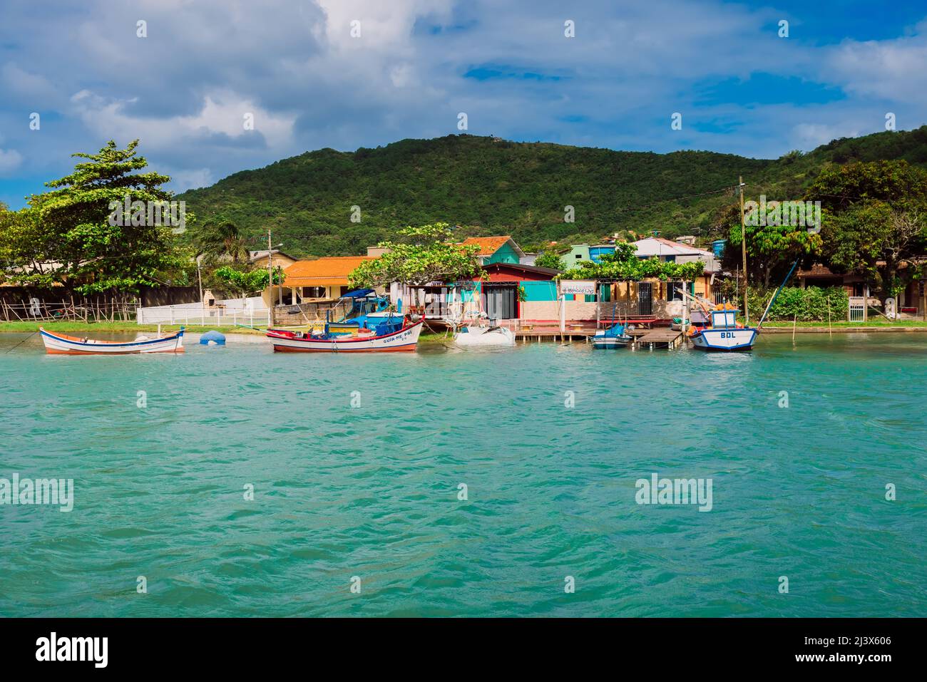 January 6, 2022. Florianopolis, Brazil. Canal of Barra da Lagoa with blue water, boats and houses Stock Photo