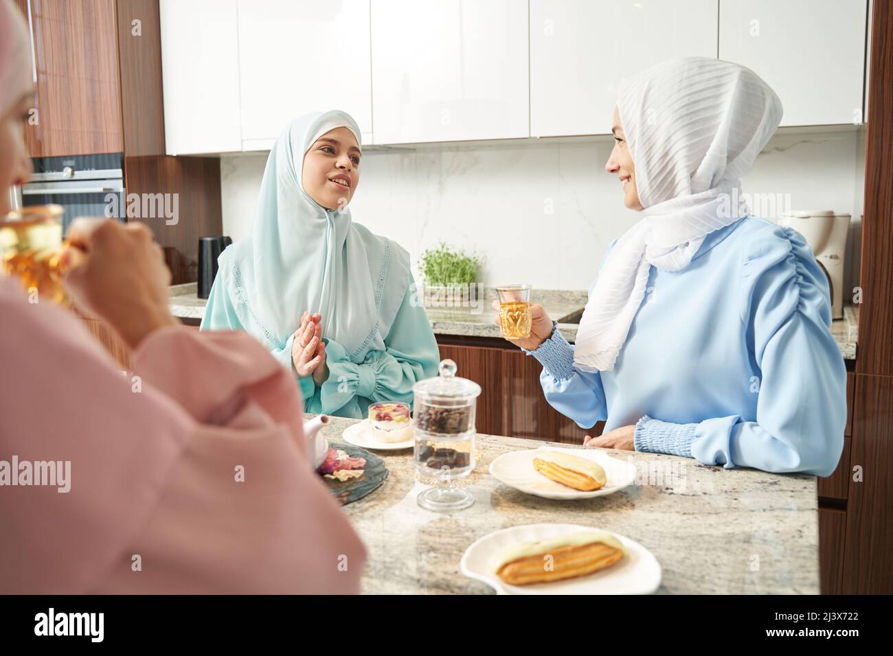 Relaxed Muslim ladies enjoying tea at home Stock Photo - Alamy