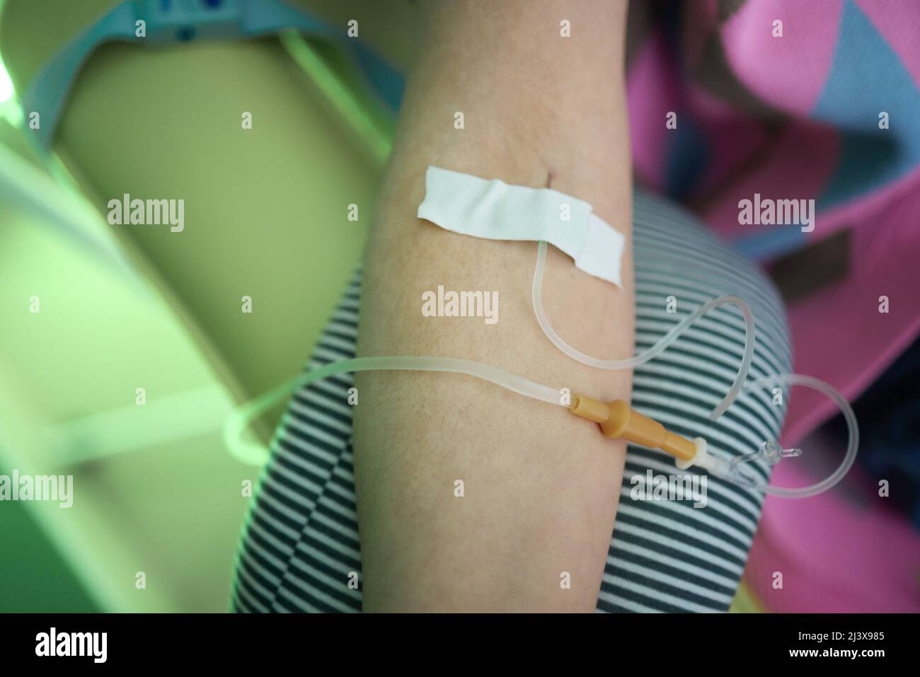 Doctor drawing blood sample from arm for blood test, closeup