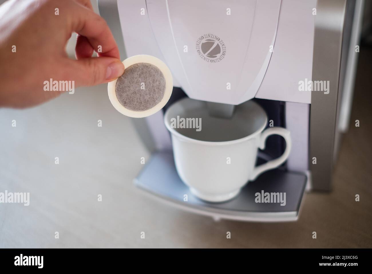Zinzino program coffee machine. Pyramid type scheme that uses person to person direct sale and network marketing to sell health products. Stock Photo