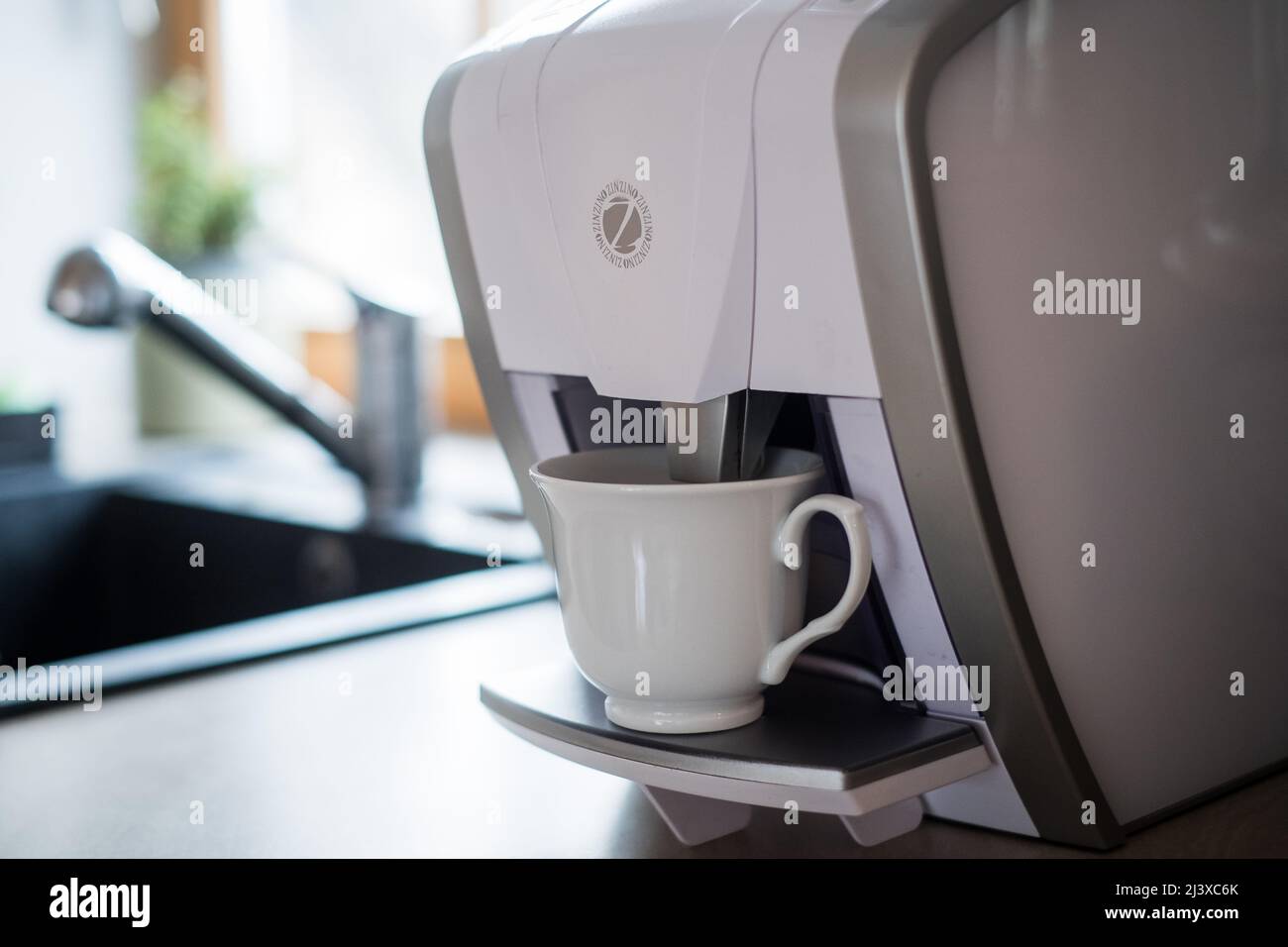 Zinzino program coffee machine. Pyramid type scheme that uses person to person direct sale and network marketing to sell health products. Stock Photo