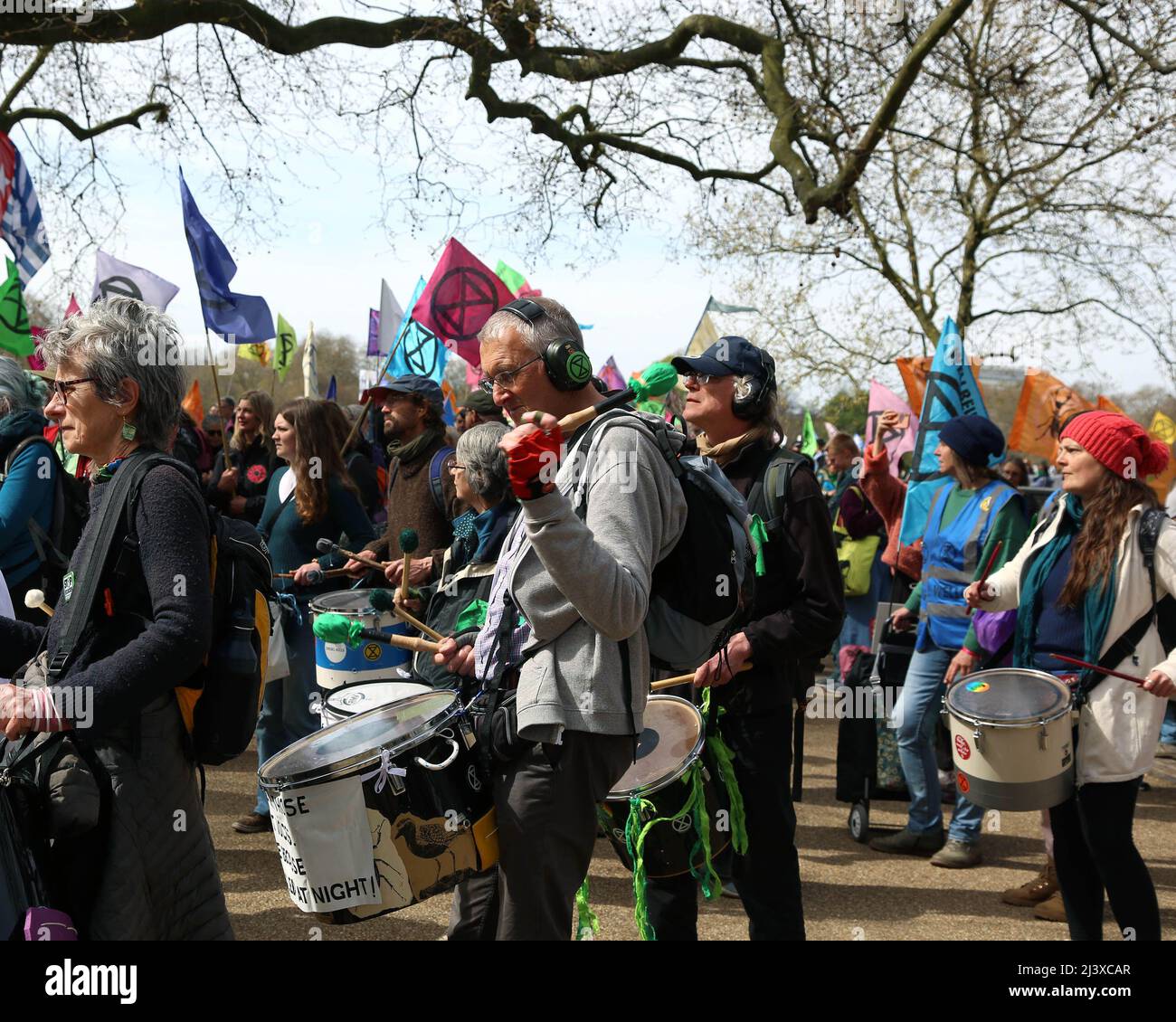 London, UK. 09th Apr, 2022. Extinction Rebellion samba drummers prepare to leave Hyde Park, London, for their march against fossil fuels and government inaction in regard to climate change. 10th April 2022. Anna Hatfield/ Pathos Credit: Pathos Images/Alamy Live News Stock Photo
