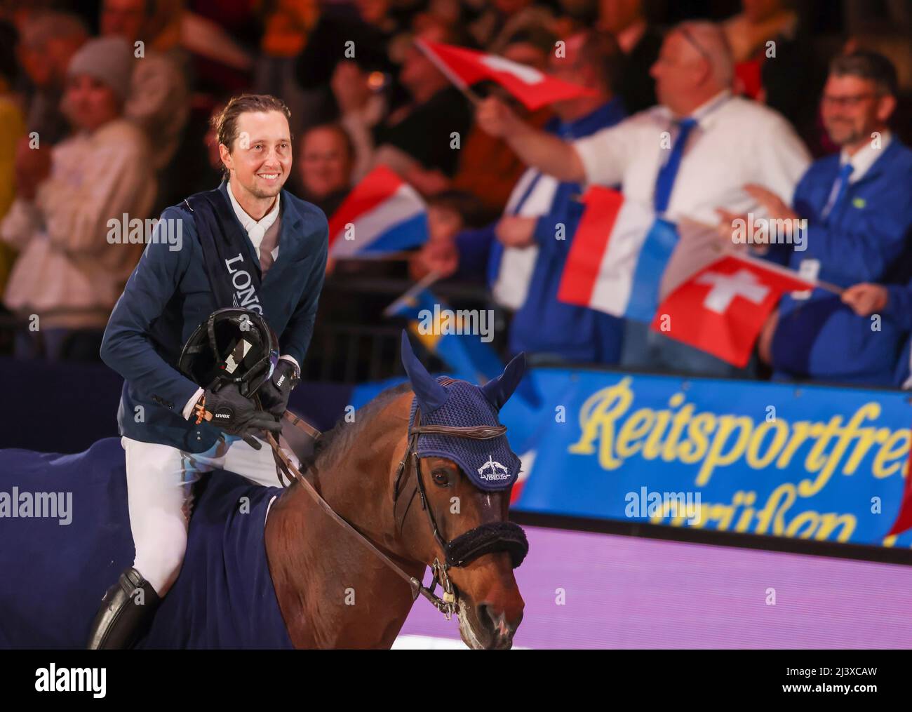 Leipzig, Germany. 10th Apr, 2022. Martin Fuchs of Switzerland rides a lap of honor after his victory on Chaplin during the final of the Longines Fei Jumping World Cup at the Leipzig Fair. Credit: Jan Woitas/dpa/Alamy Live News Stock Photo