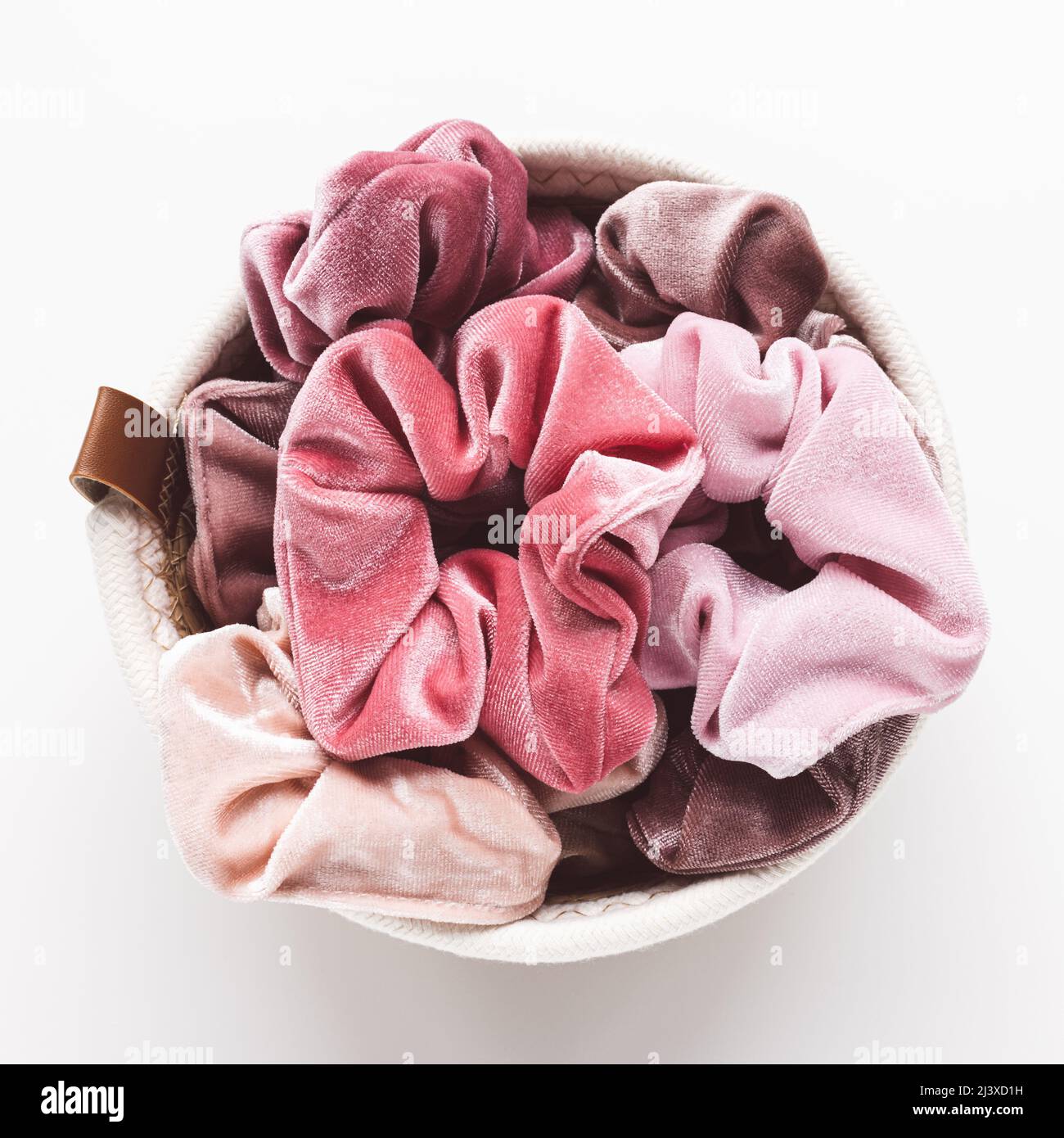 Trendy pink velvet scrunchies in basket for accessories on white  background. Diy accessories, fashion and lifestyle concept. Top view,  closeup, copy space Stock Photo - Alamy