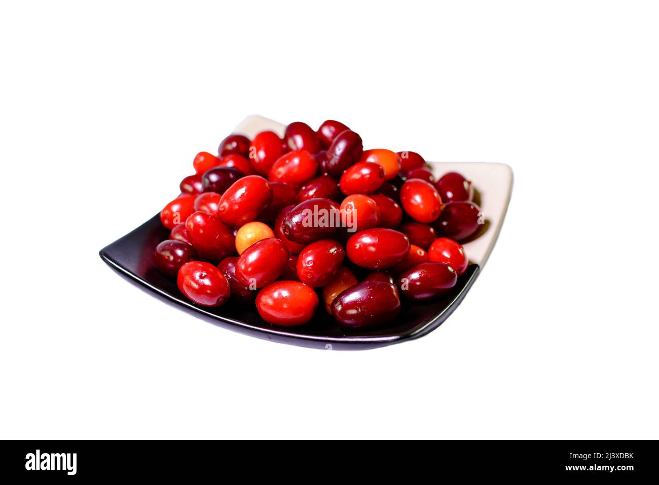 dogwood berries in a ceramic dish. Isolated Stock Photo