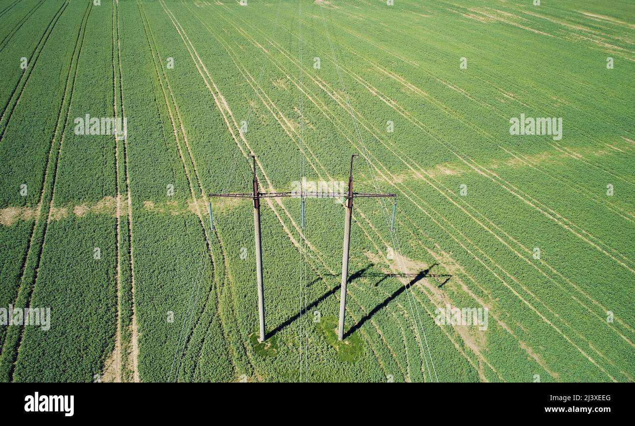 Electric energy pylons with wire lines check from aerial drone view Stock Photo