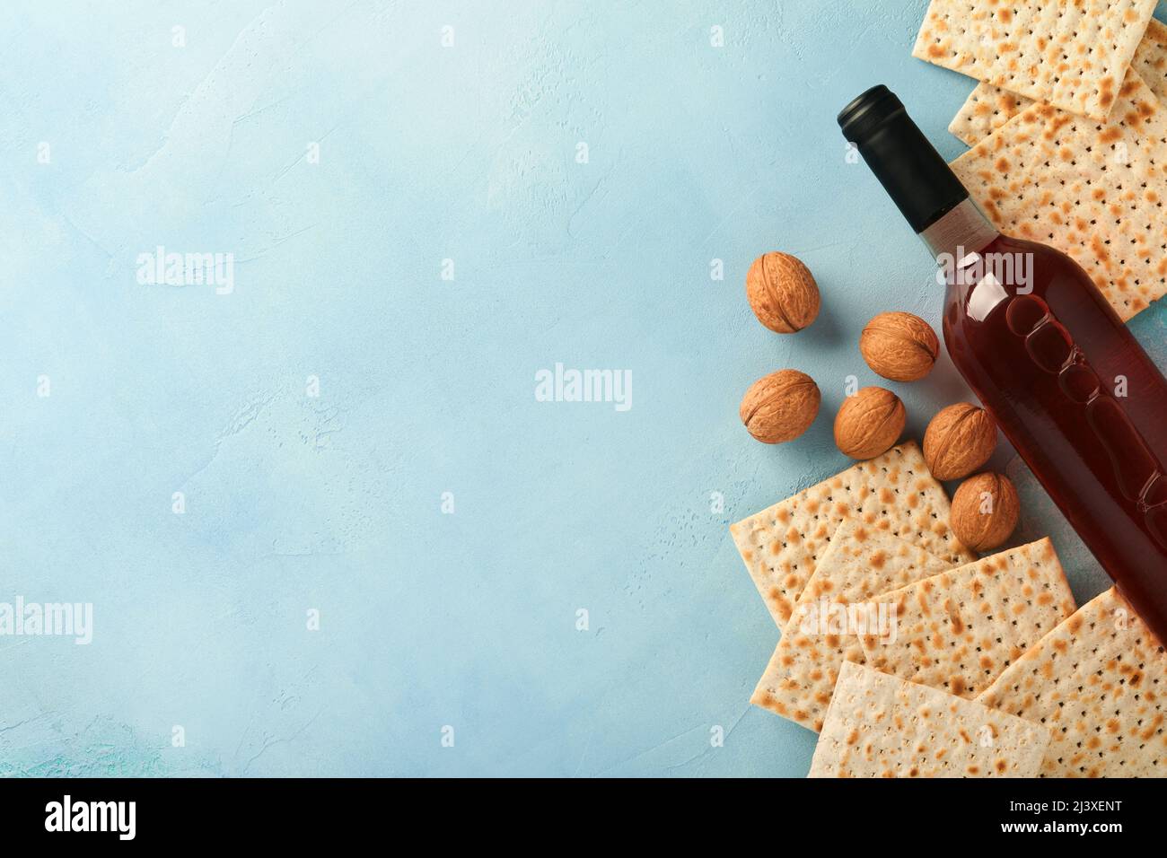Passover celebration concept. Matzah, red kosher walnut and spring