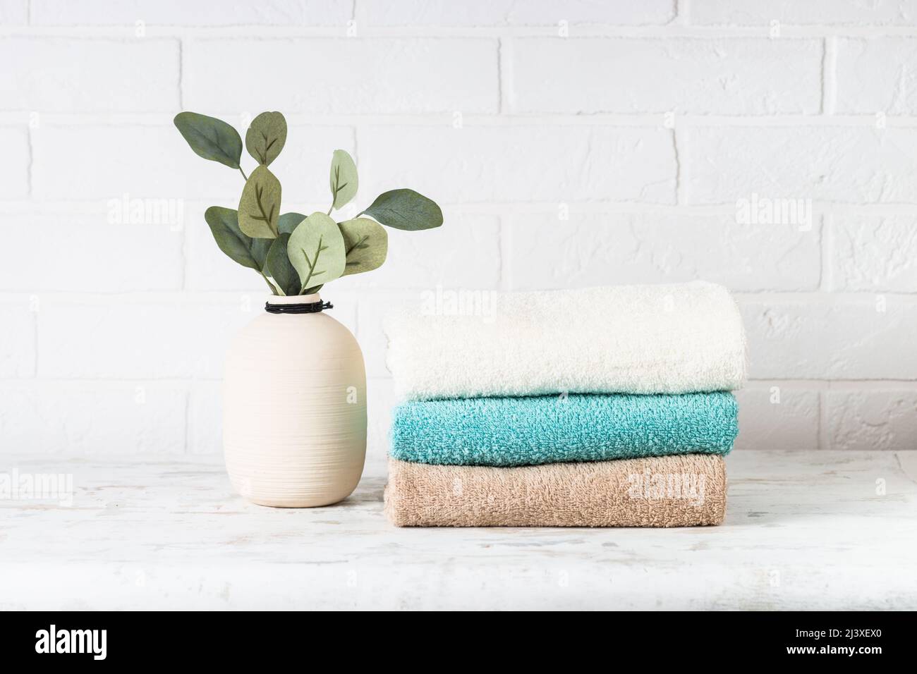 Stack of bath towels in white bathroom Stock Photo Alamy