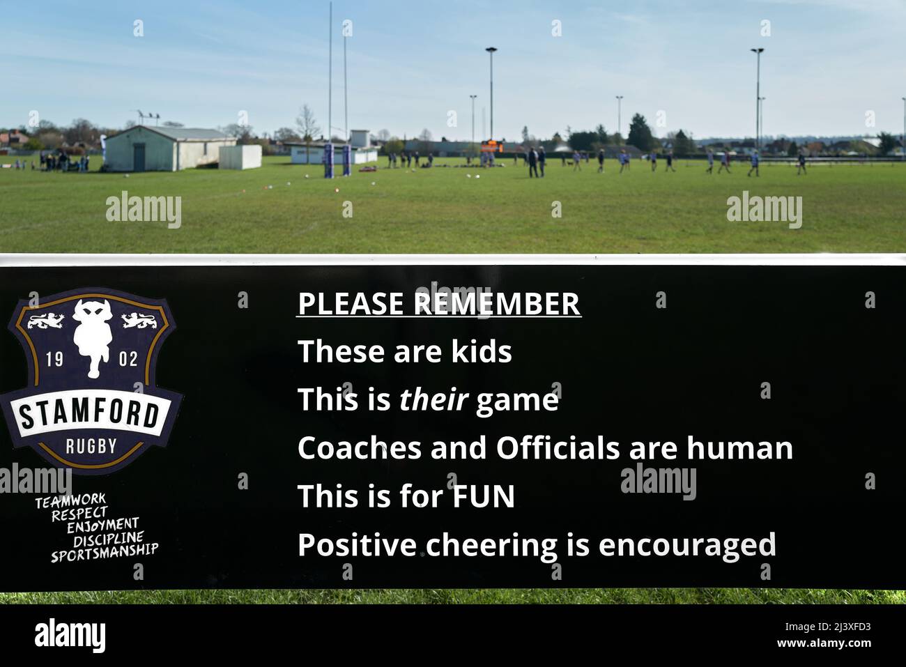 Rugby notice at Stamford rugby club: this is a kids' game for fun, coaches and officials are human, positive cheering is encouraged. Stock Photo