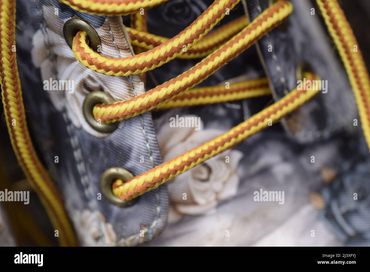 undone laces on ladies boot Stock Photo