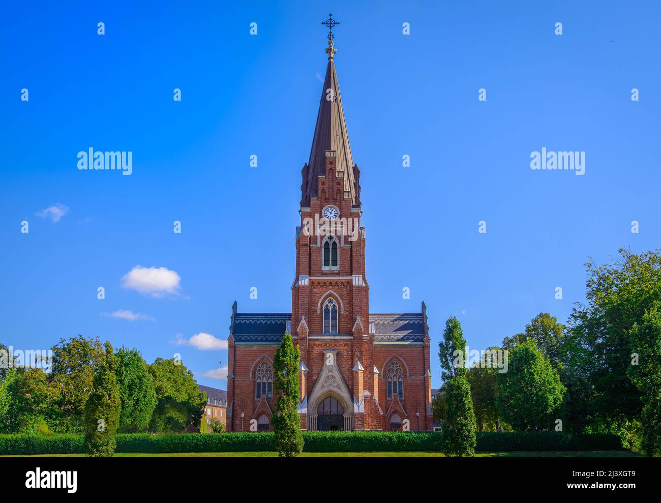 View to 'All Saints Church' inaugurated in 1891 in Lund, Sweden. The church is built in a Neo-Gothic style and has 72-meter-high tower. Stock Photo