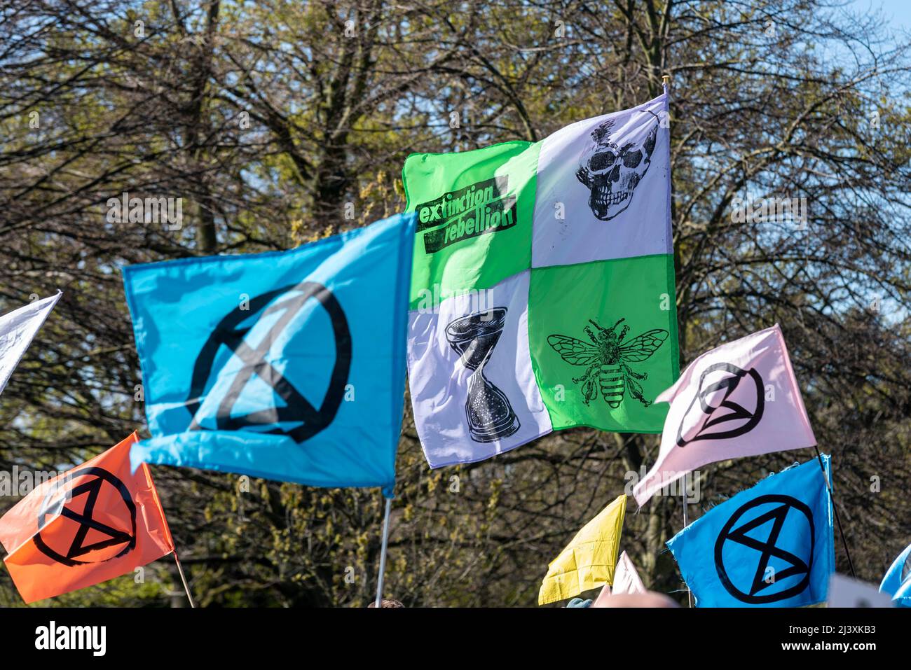 Extinction Rebellion protesters launching a period of civil disruption in London from the 9 April 2022. XR symbol flags in Hyde Park Stock Photo