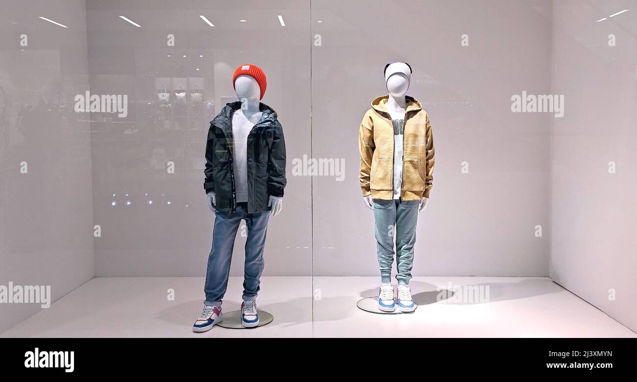 Children's mannequins in shop. Showcase of kids store Stock Photo Alamy