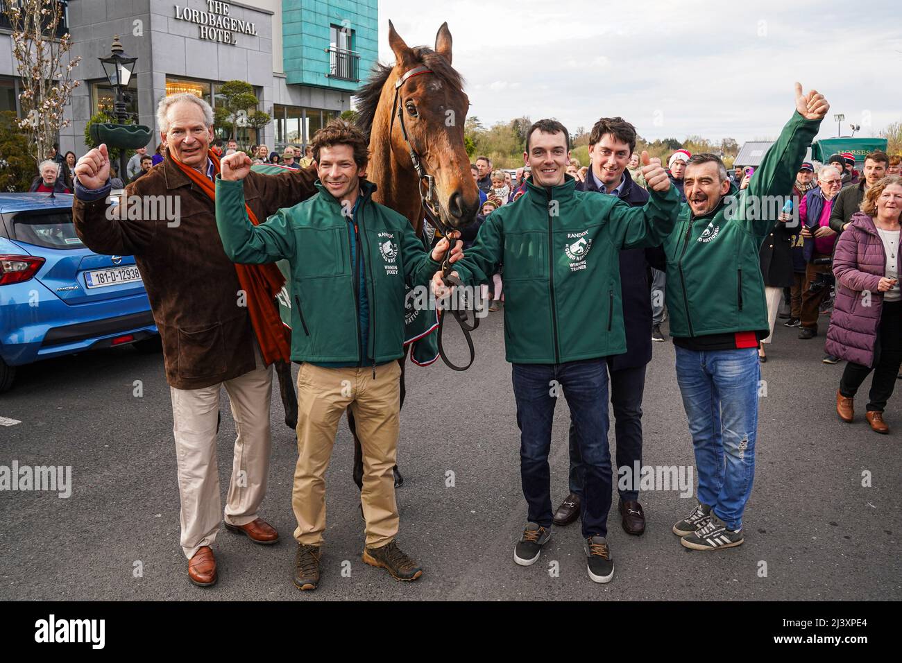 Winning owner Robert WaleyCohen (far left), jockey Sam WaleyCohen