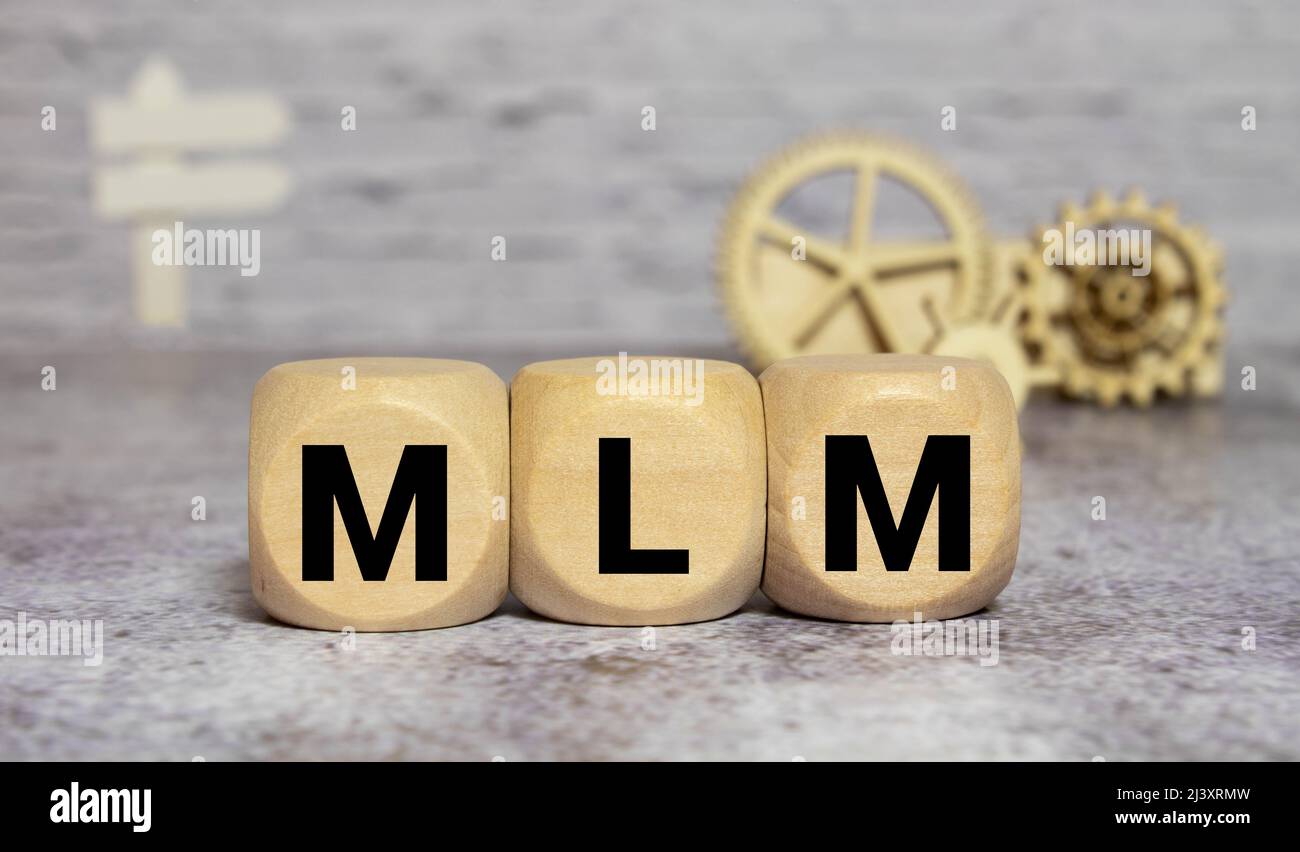Wooden letters spelling MLM, management concept sign Stock Photo