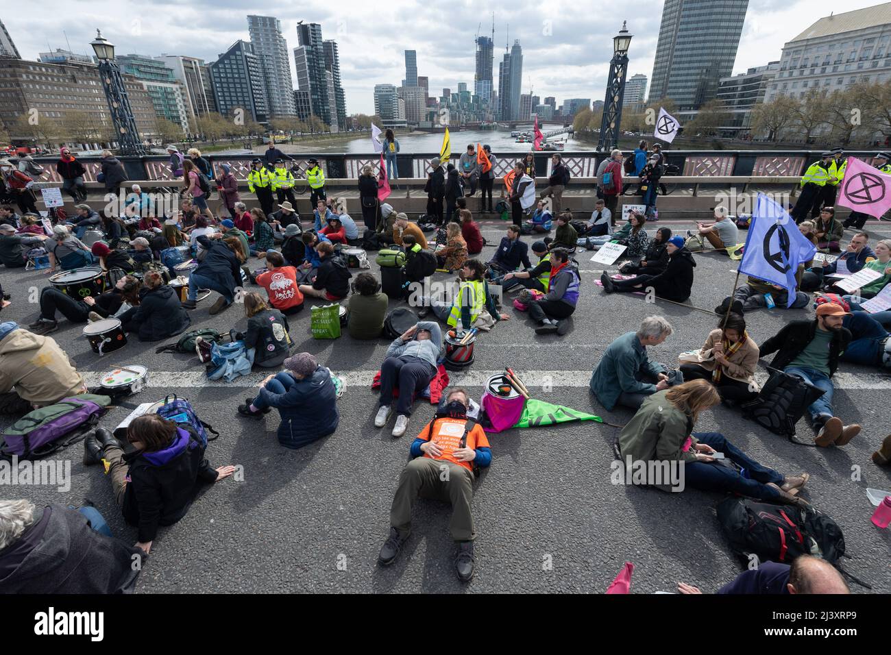10/04/2022. London, UK. Protesters sit on Lambeth Bridge taking part in a an Extinction Rebellion demonstration calling for an end to fossil fuels. Photo by Ray Tang. Stock Photo