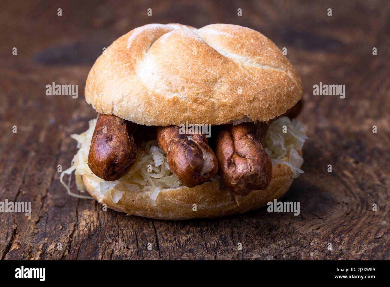Nuremberg sausages with sauerkraut in a bun Stock Photo Alamy