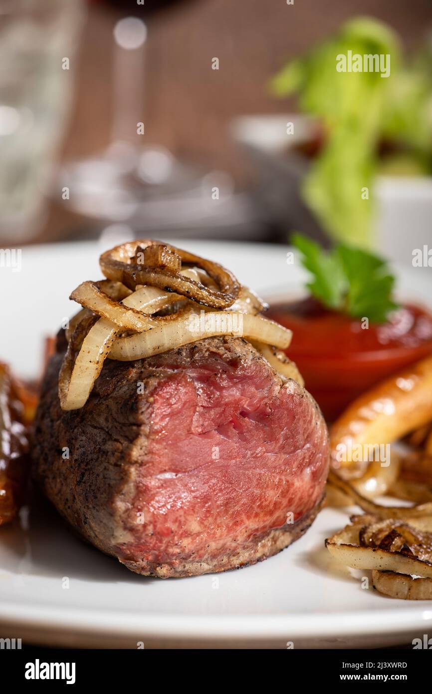 grilled steak with onion rings Stock Photo Alamy