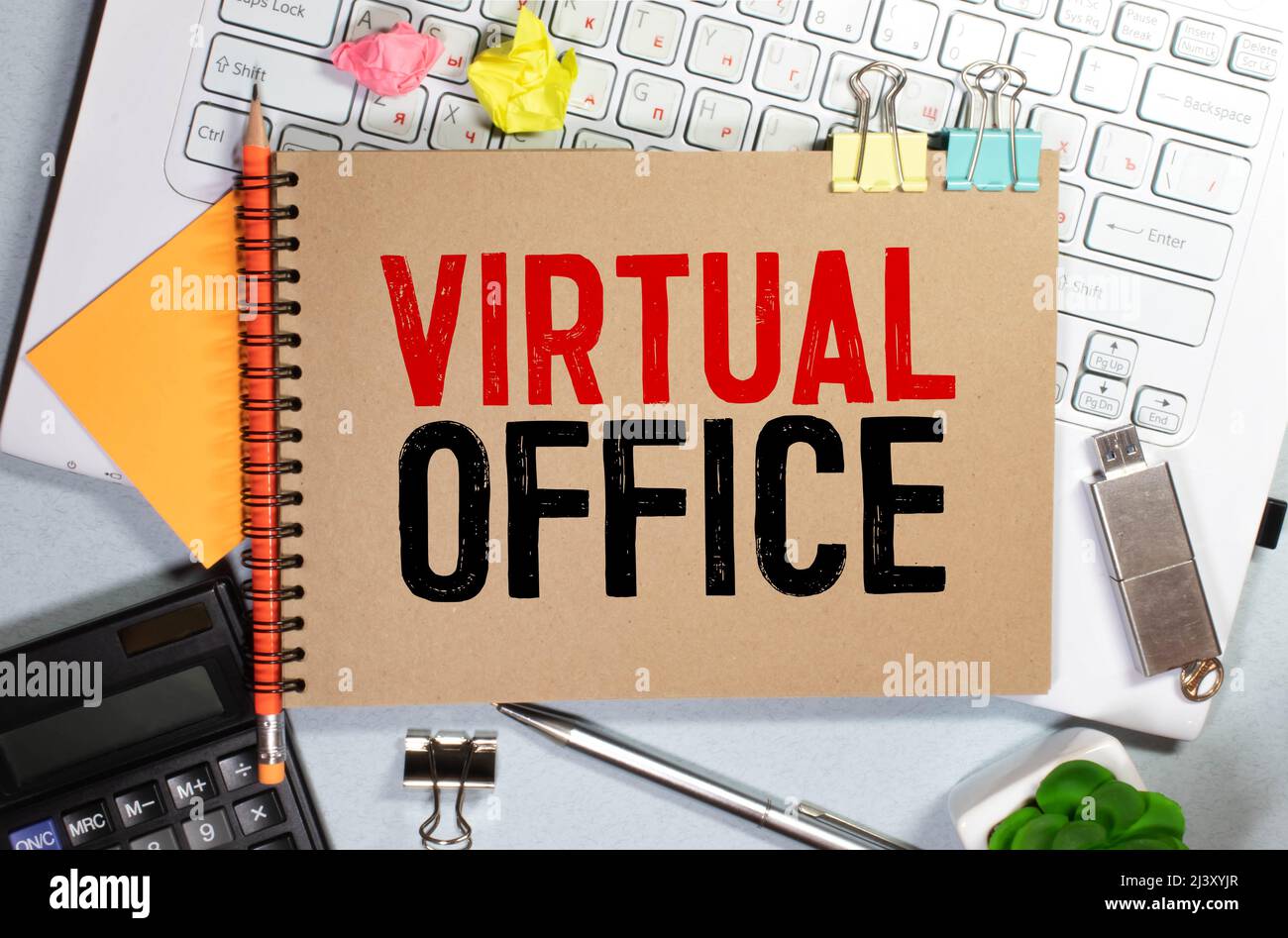 VIRTUAL OFFICE. text on white paper on gray background. Stock Photo