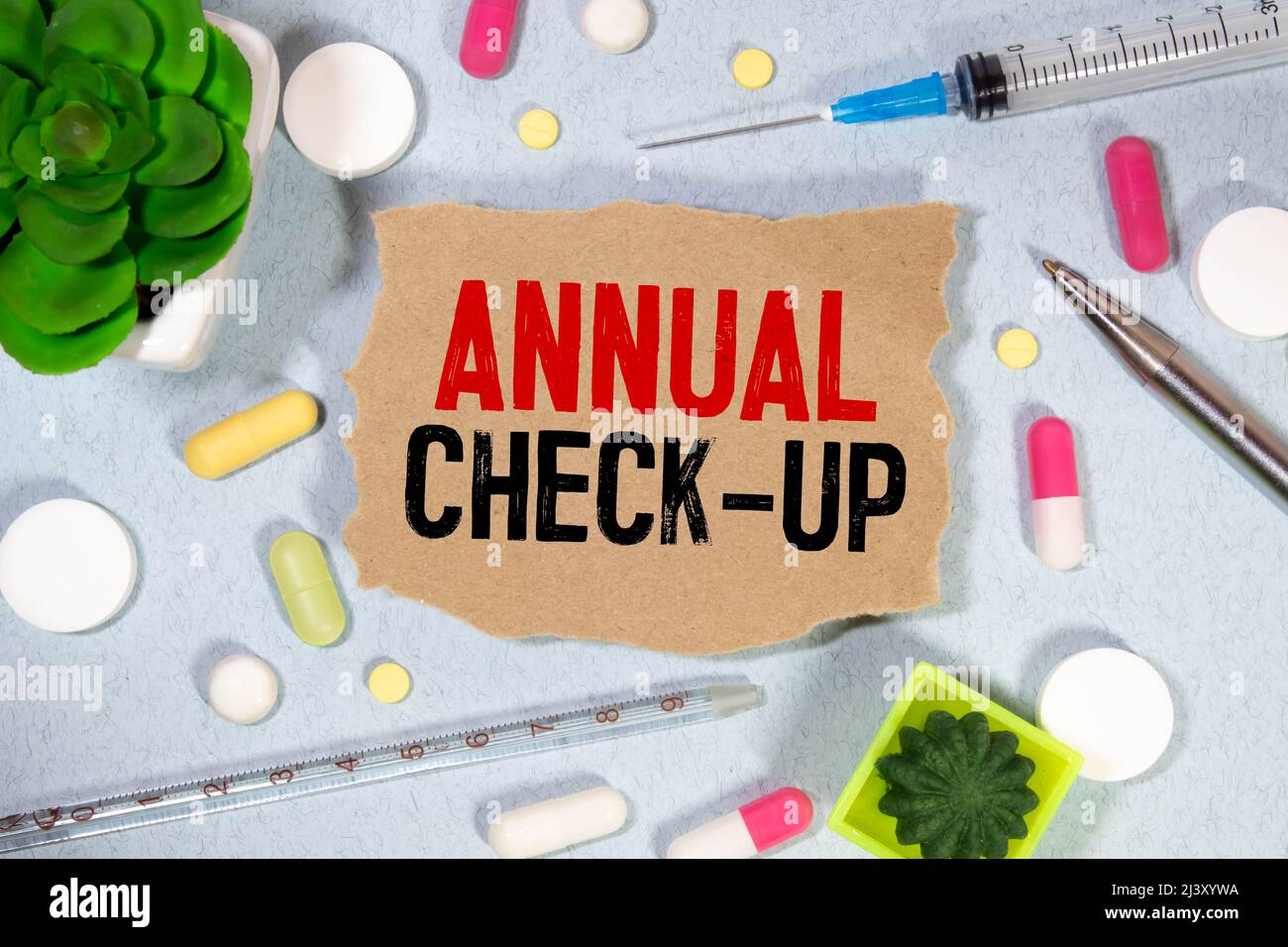 Annual Check-up text on paper with heart beat diagram, stethoscope ...