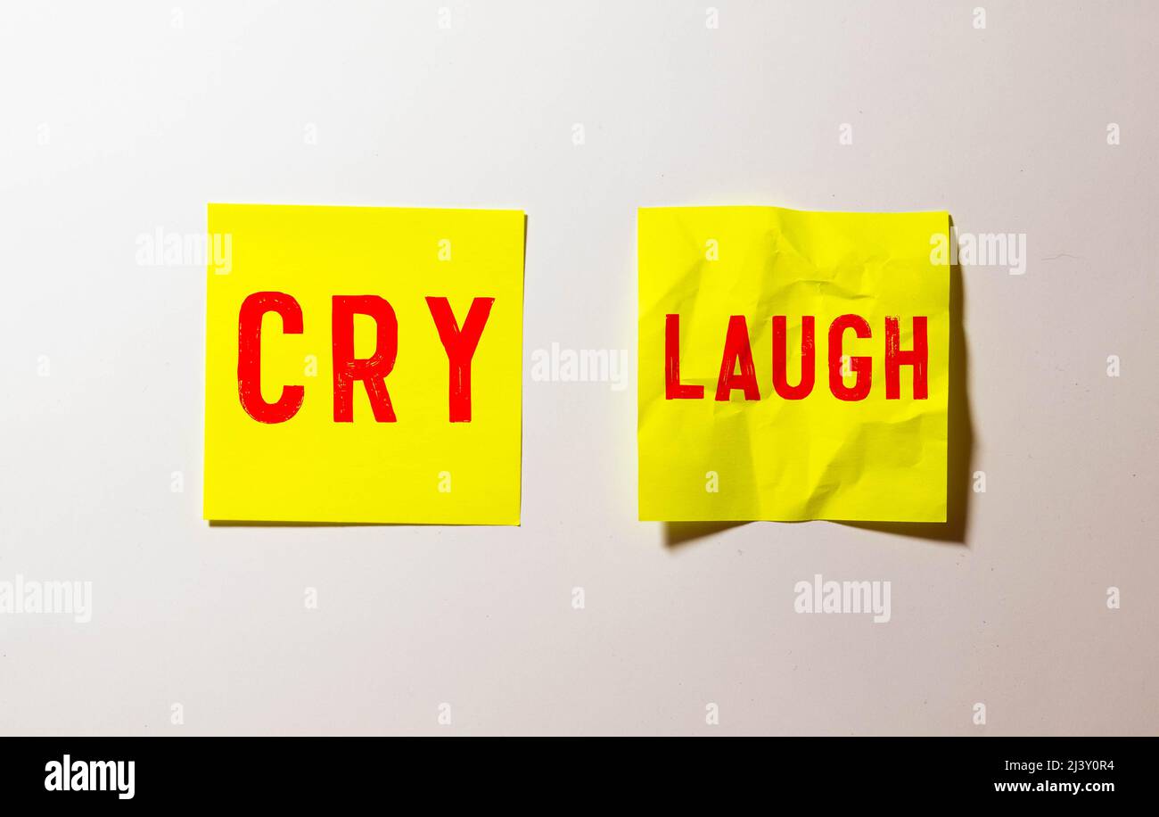 Word Empathy made of colorful letters and funny faces drawn on notes on the dark background Stock Photo