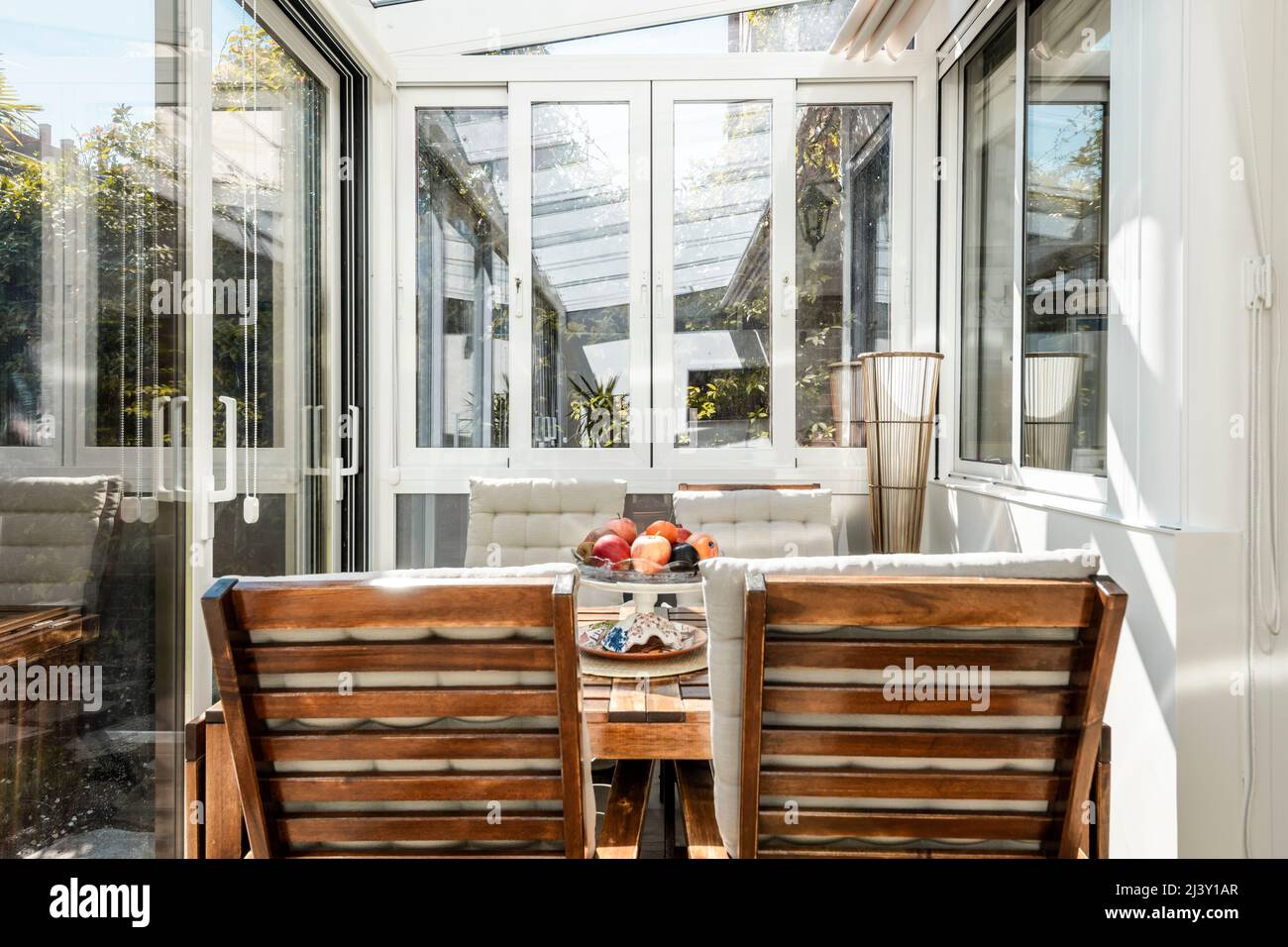 Interior of white aluminum and glass closed terrace with large