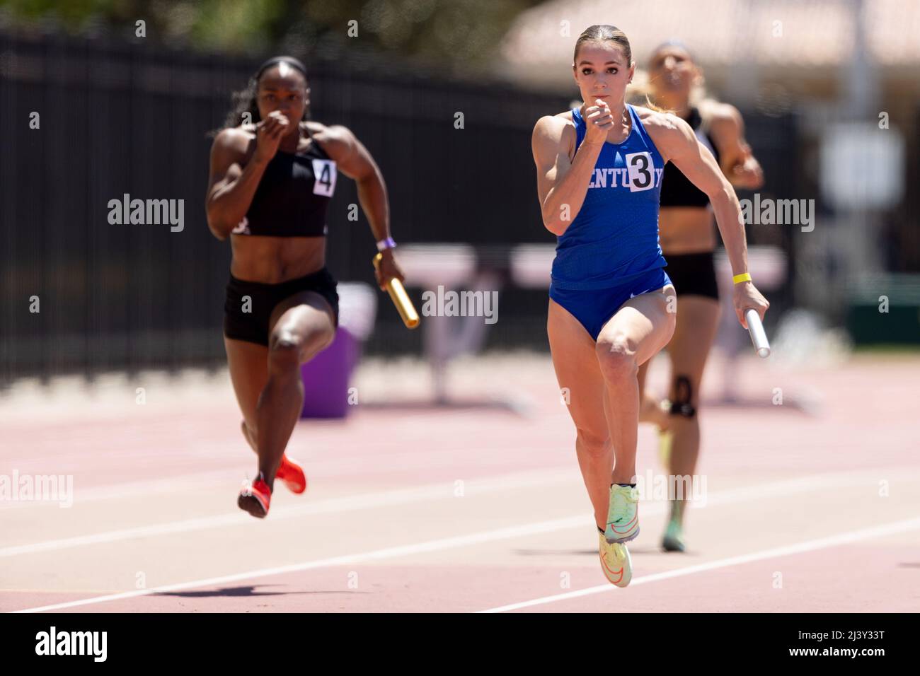 Abby Steiner of Kentucky runs the 2nd leg of the 4 x 100 relay