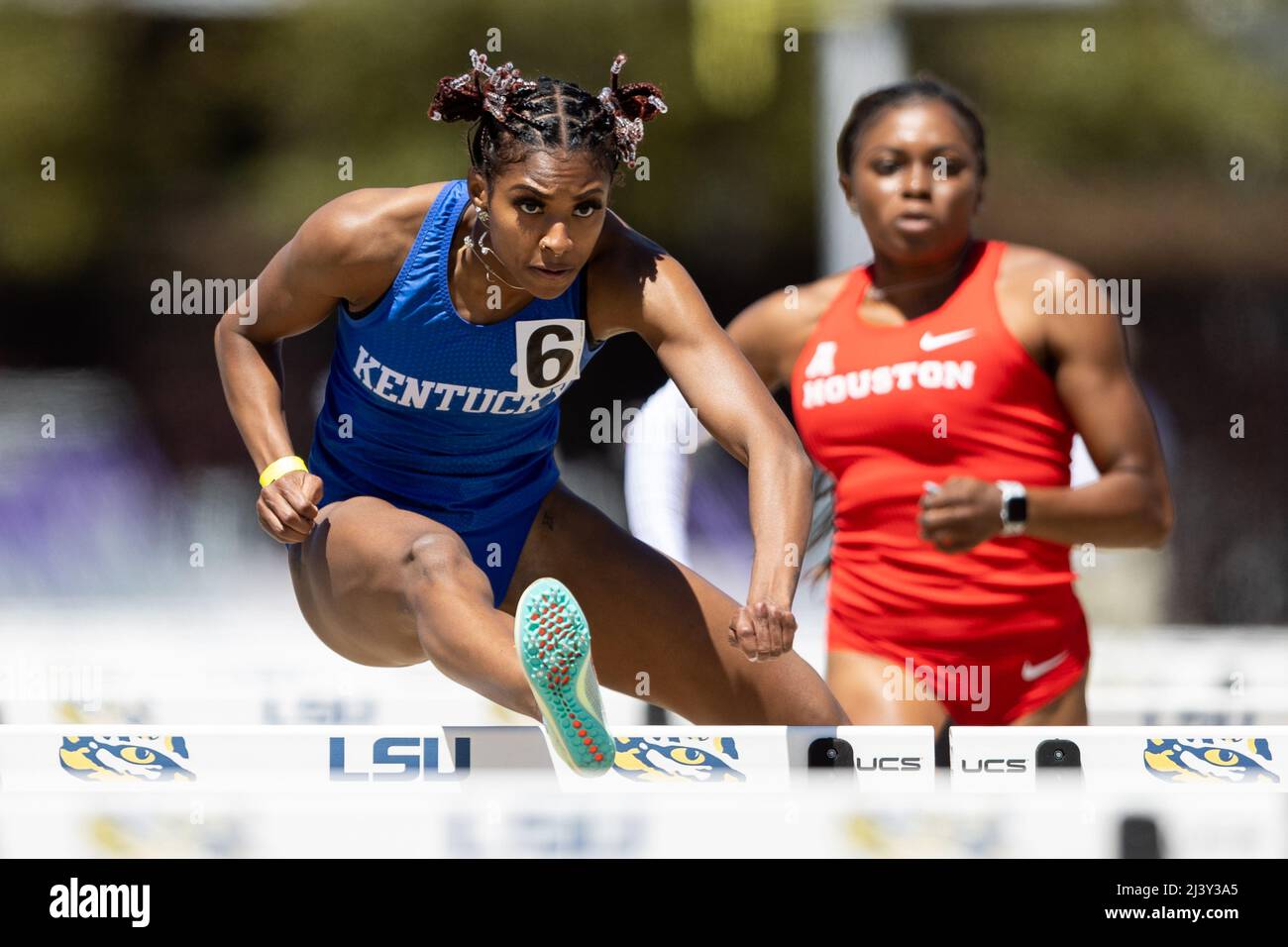 Masai Russell of Kentucky runs the 100 hurdles in a time of 12.75