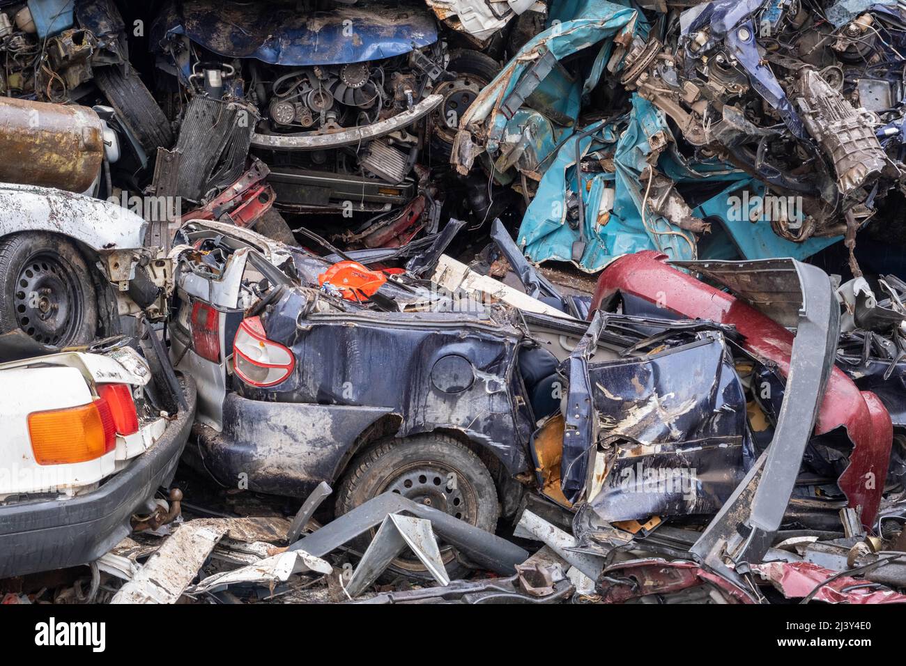 Stacked crushed cars going to be shredded in a recycling facility Stock ...
