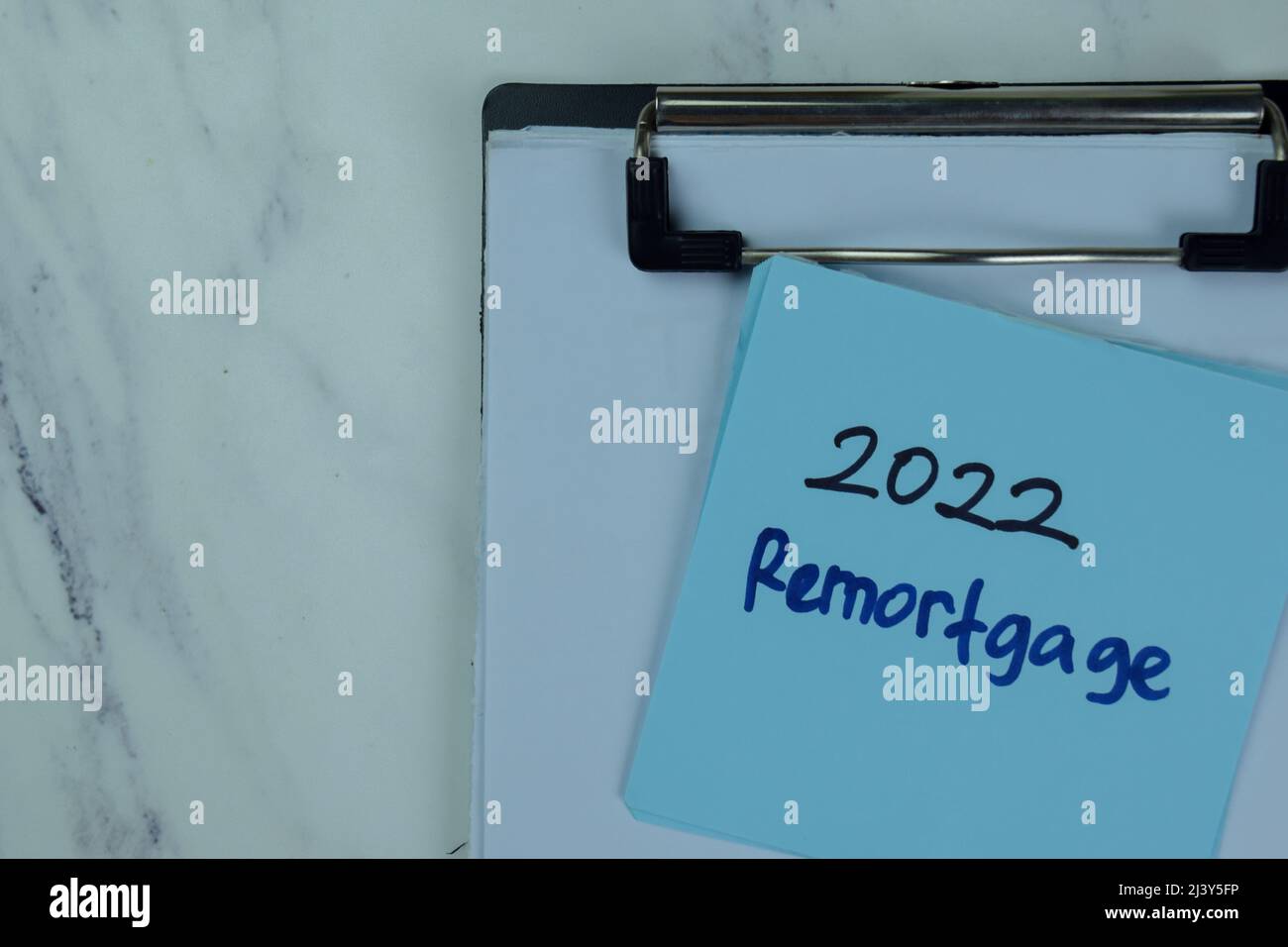 2022 Remortgage write on sticky notes isolated on Wooden Table. Stock Photo