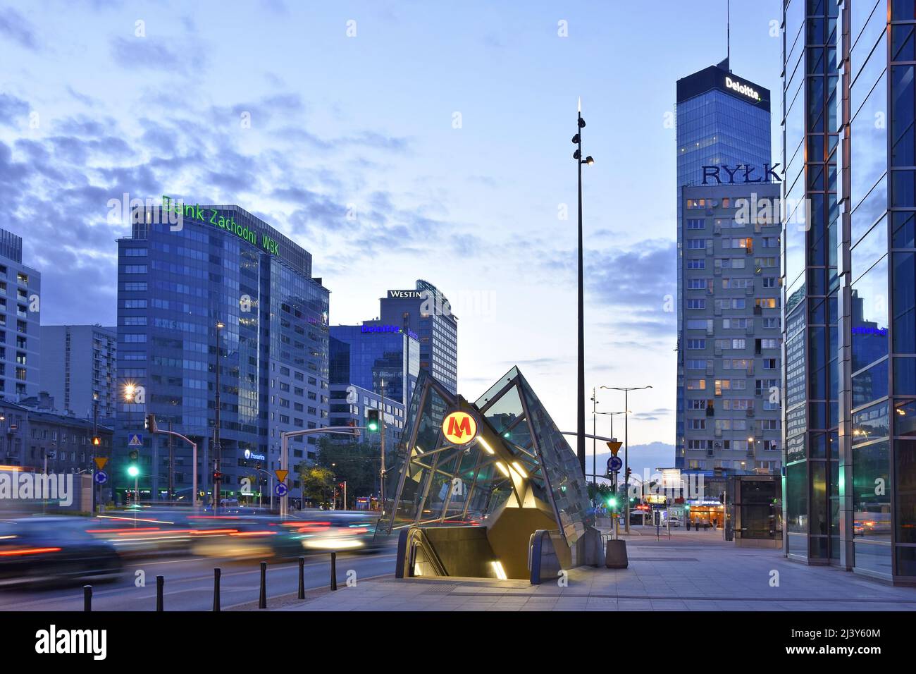 Modern Rondo ONZ metro station entrance and commercial properties at dusk in Warsaw Poland. Stock Photo