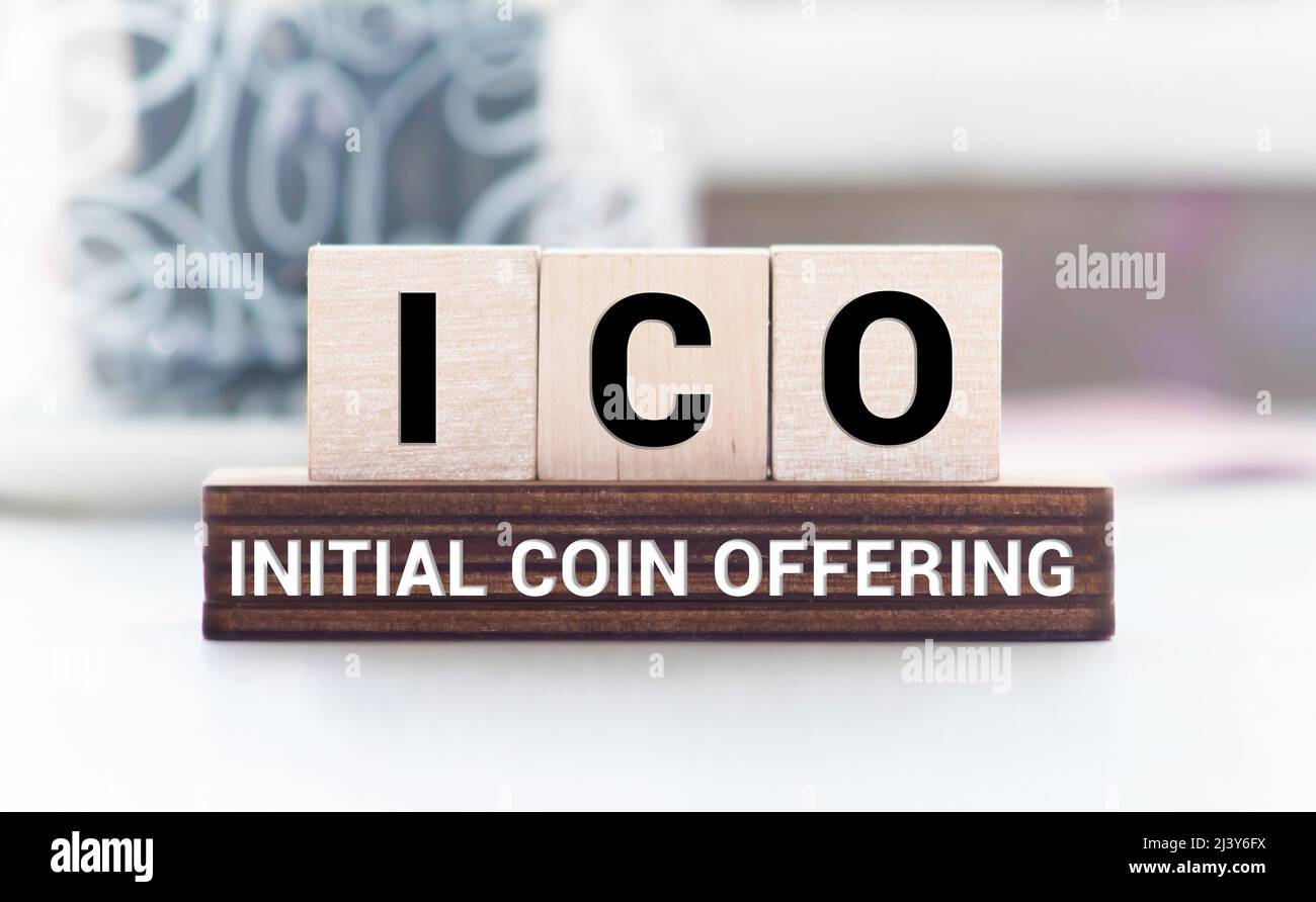 ICO abbreviation stands for Initial Coin Offering on wooden blocks, yellow  background. Cryptocurrencies concept Stock Photo - Alamy