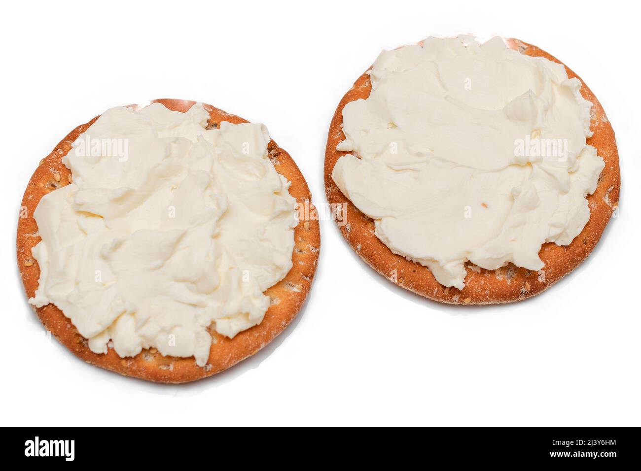 Crispy Cracker Sandwich with Cream Cheese Isolated on White Stock