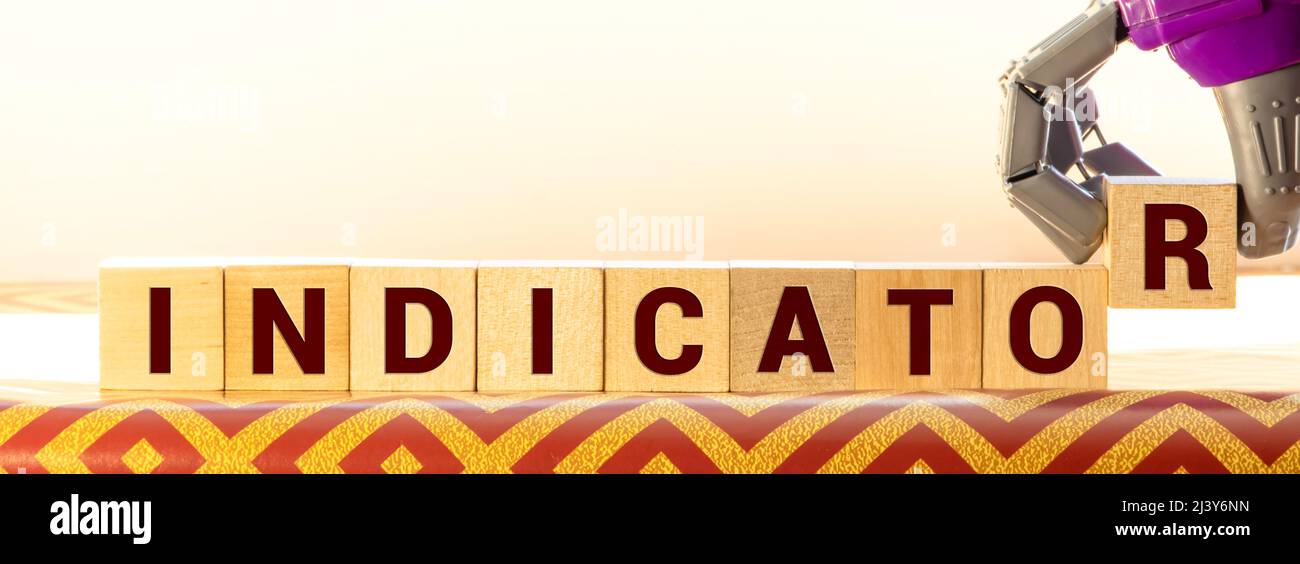 Indicate word on wooden blocks on cyan background. Financial indicator ...