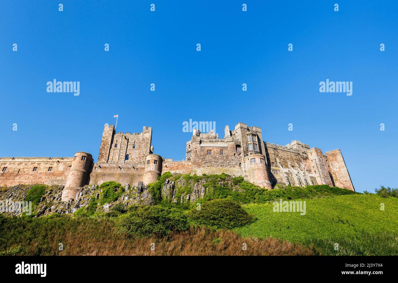 The outer walls of iconic Bamburgh Castle on the north-east coast of ...