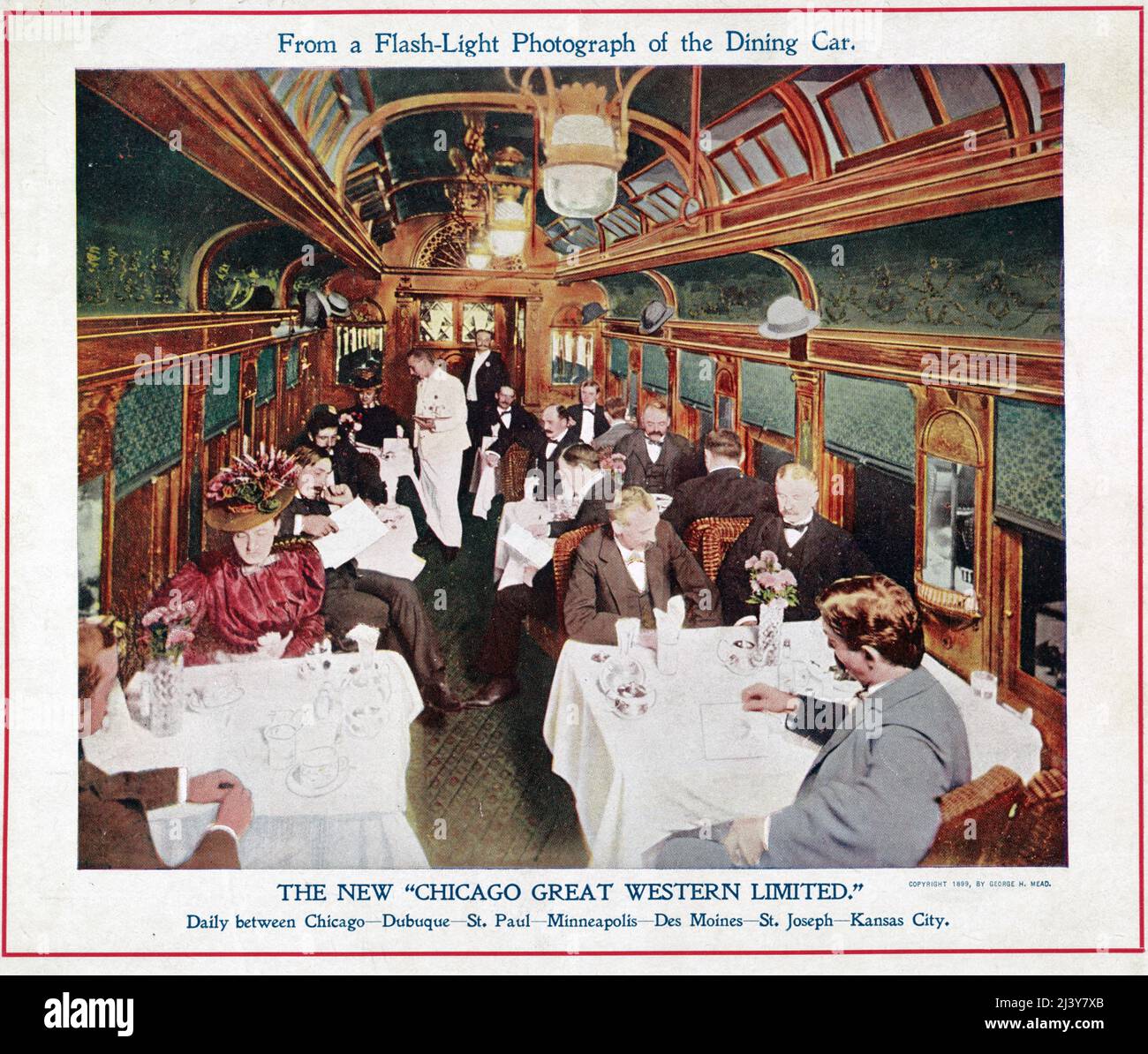 The new 'Chicago Great Western Limited' daily between Chicago--Dubuque--St. Paul--Minneapolis--Des Moines--St. Joseph--Kansas City.   Photograph shows interior view of railroad dining car filled with passengers dining, circa 1899 Stock Photo