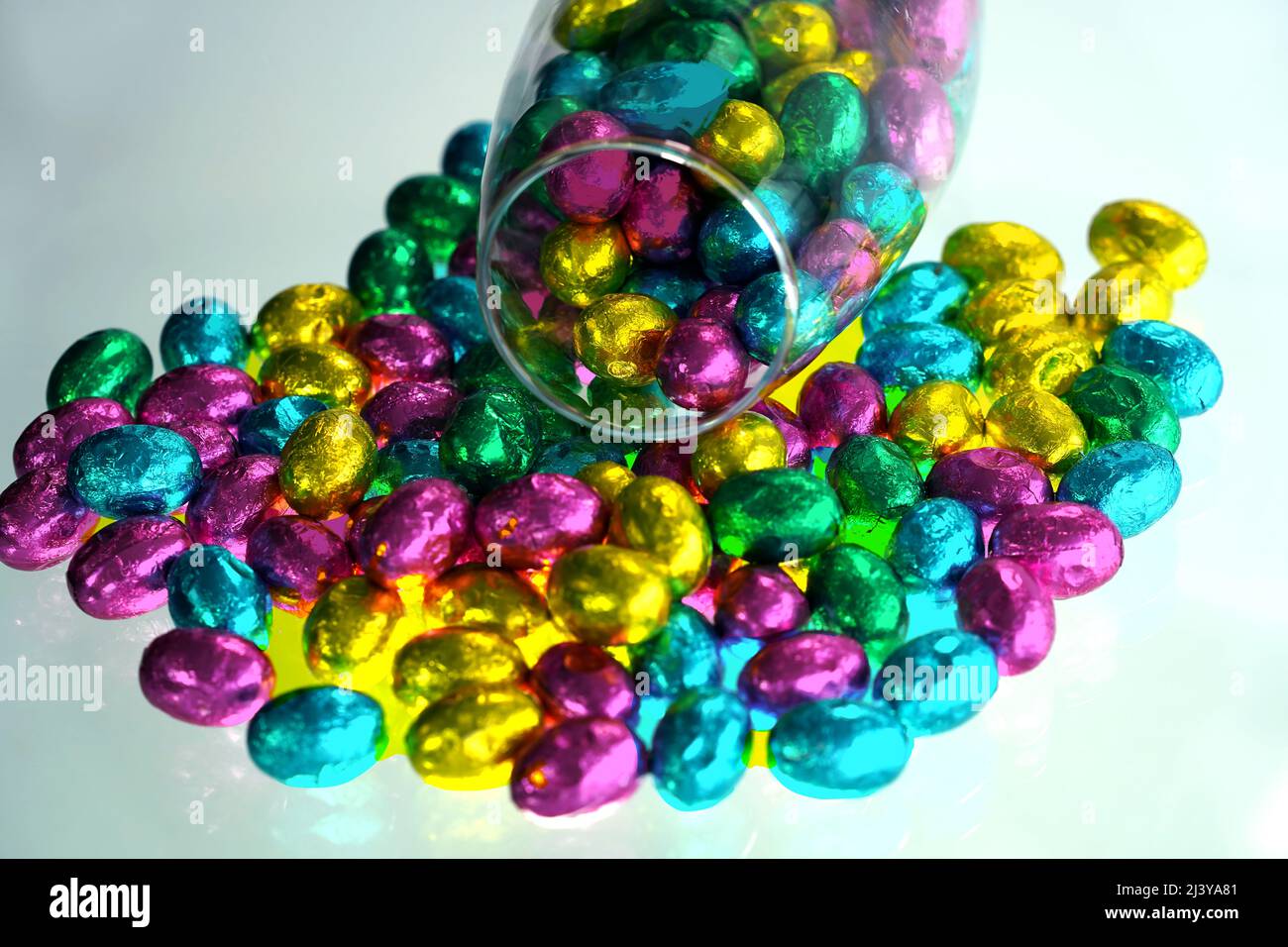 Multi-colored Easter eggs wrapped in foil. Stock Photo