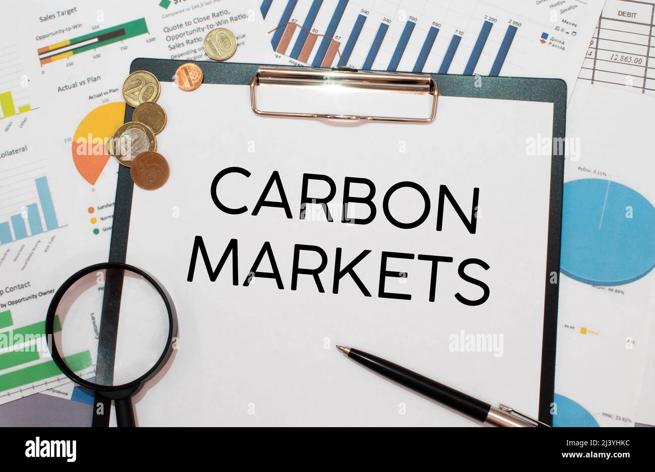 CARBON MARKETS. text on white paper near dollar bills Stock Photo Alamy