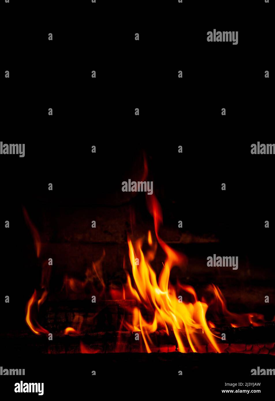 Fire on a black background. Red, orange and yellow flames and sparks on ...