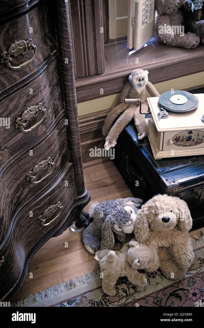 Vintage  stuffed toys and dresser or chest of drawers Stock Photo