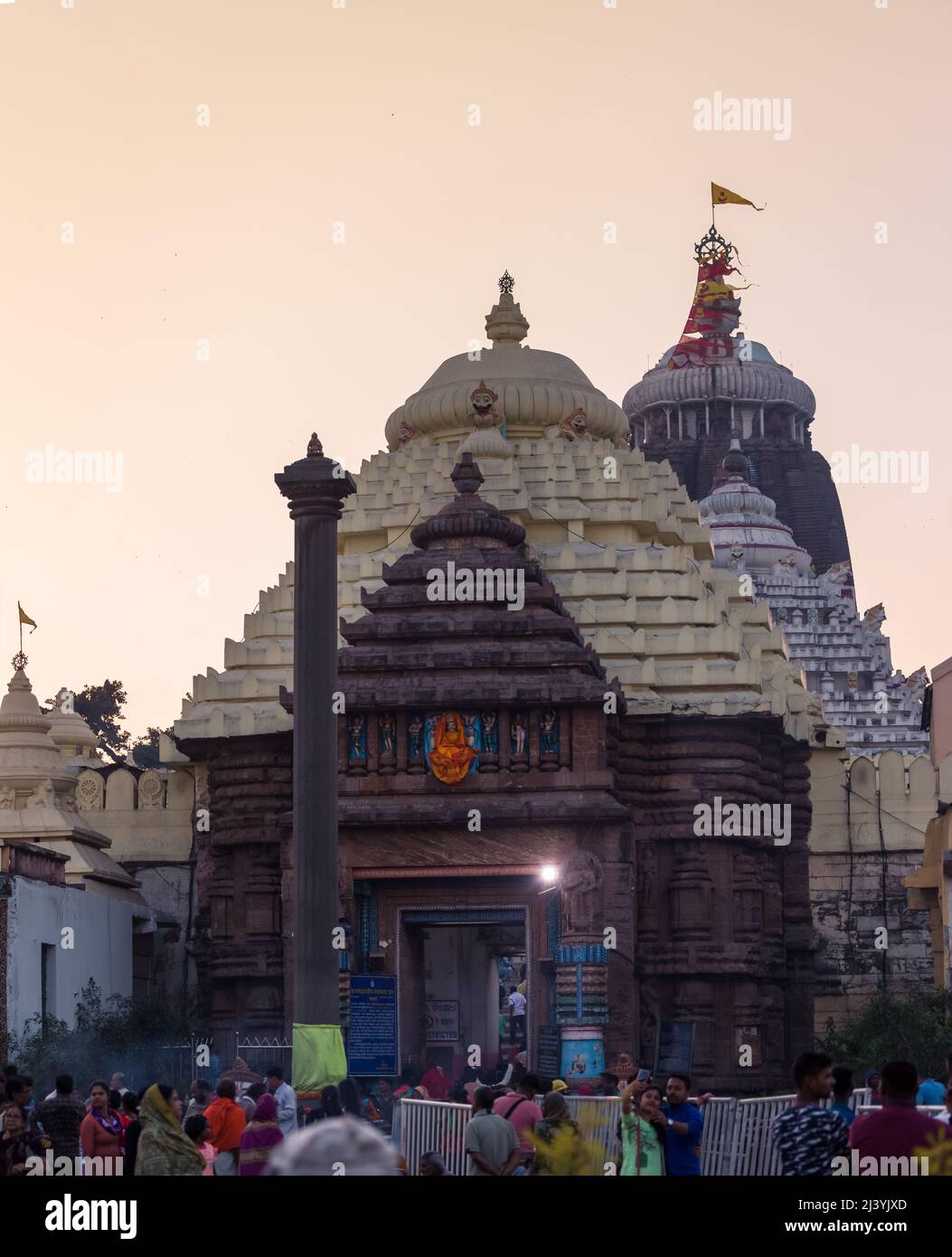 Devotees at the entrance of Main temple dome of Jagannath Temple, dedicated to Jagannath or Lord Vishnu in the coastal town of Puri, Odisha, India. Stock Photo