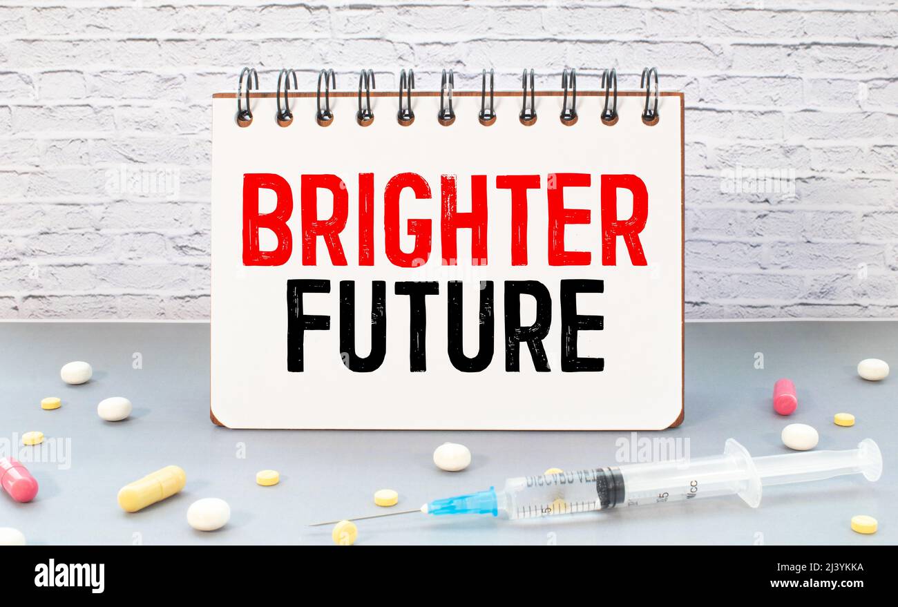 Brighter Future text on notepad on office desk Stock Photo