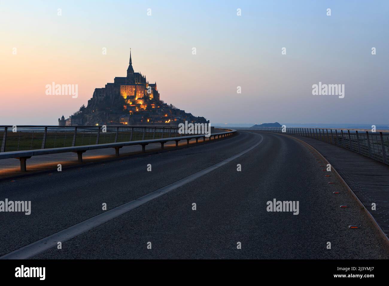The Mont-Saint-Michel (Saint Michael's Mount), a medieval Christian tidal islet and UNESCO World Heritage Site at twilight in Normandy, France Stock Photo
