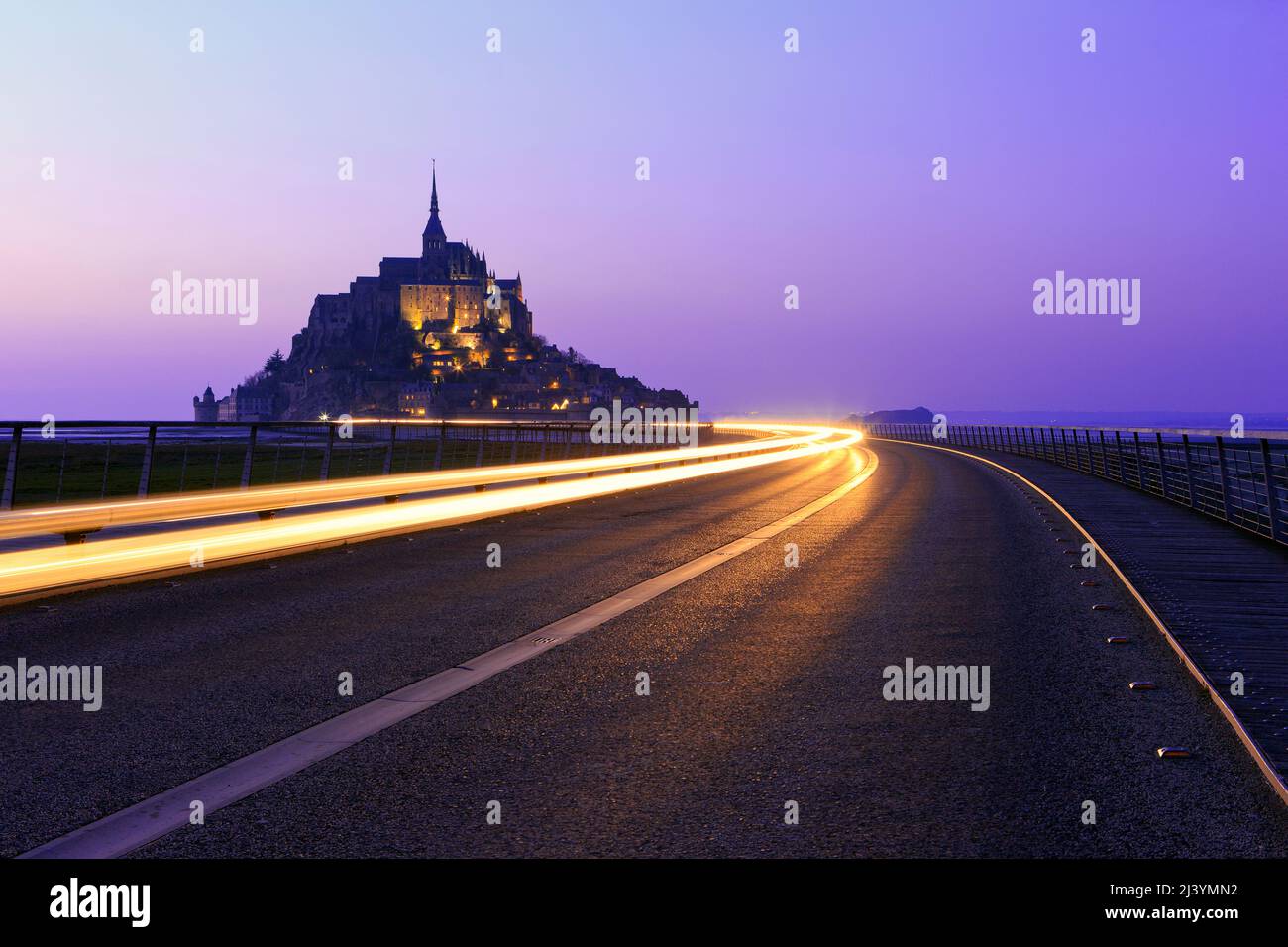 The Mont-Saint-Michel (Saint Michael's Mount), a medieval Christian tidal islet and UNESCO World Heritage Site at twilight in Normandy, France Stock Photo