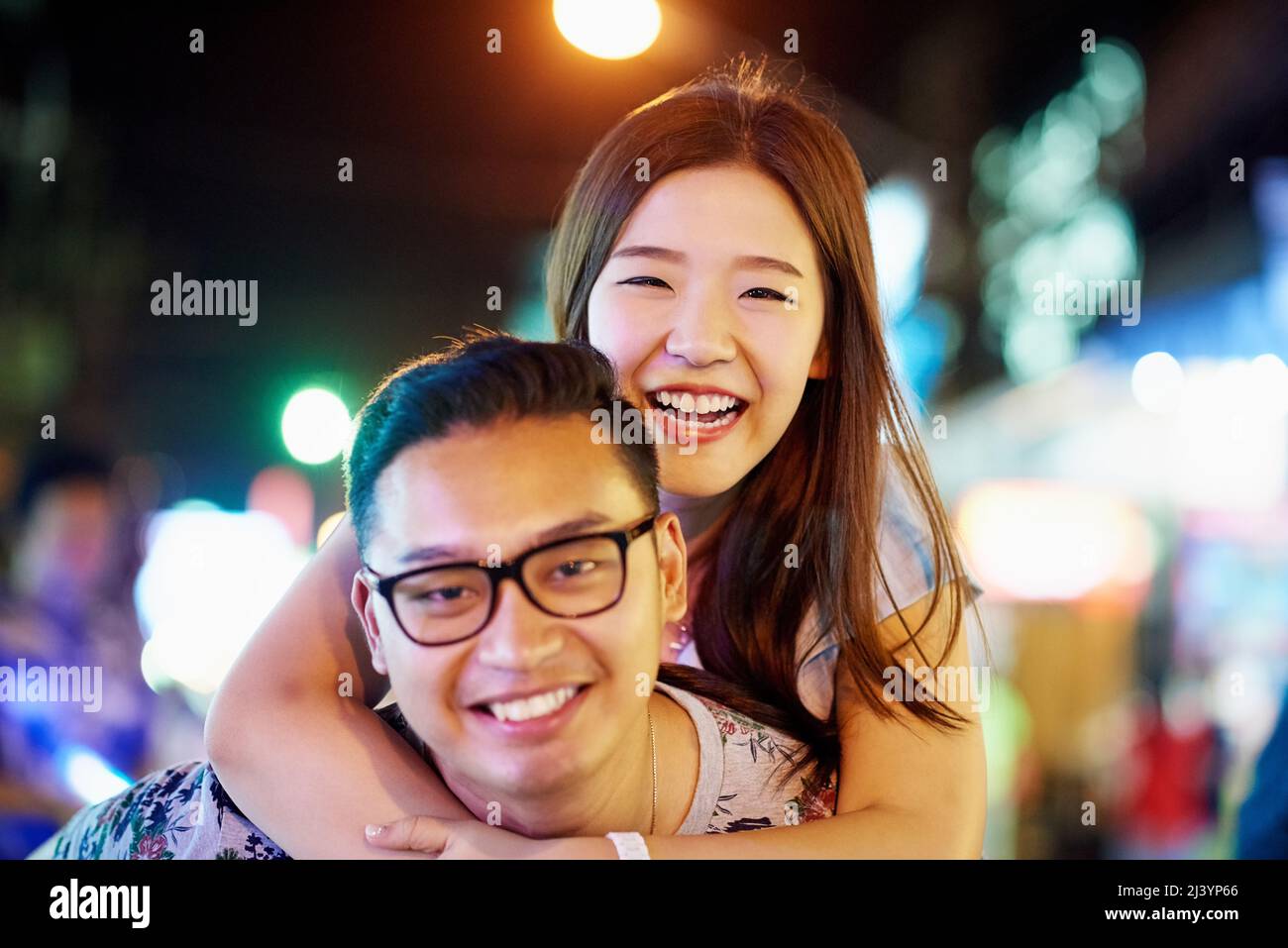 Were having so much fun in the city. Shot of a happy young couple spending the night out in the city. Stock Photo