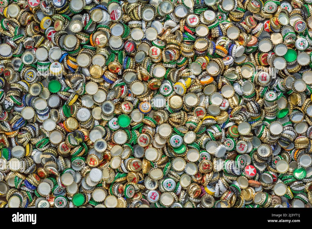 Berlin, Germany, 12.05.2018, enormous quantity of metal beer caps in golden, red, green, blue, white, silver etc. Recycling, environment, ecology Stock Photo