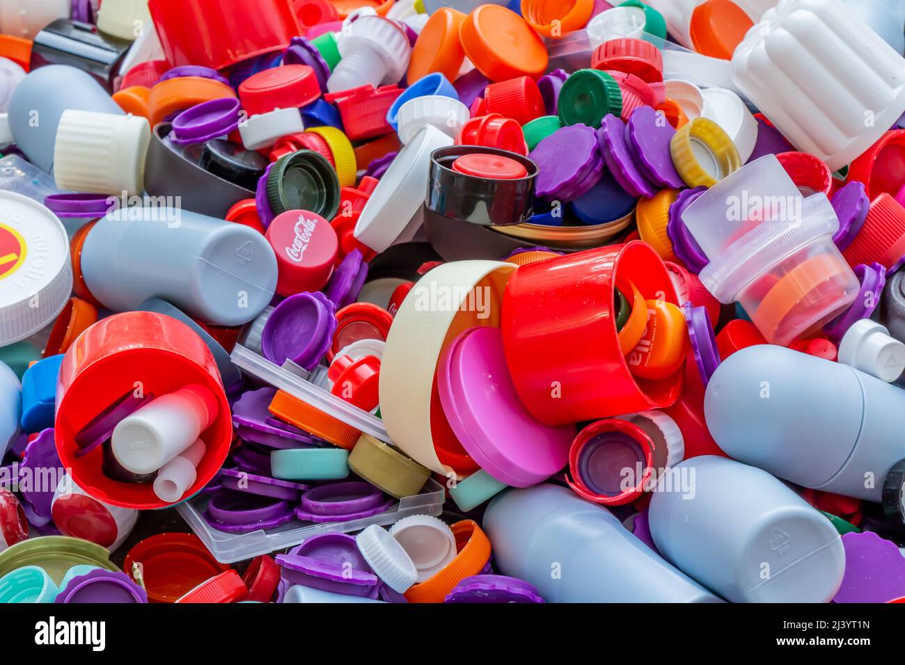 https://c8.alamy.com/comp/2J3YT1N/berlin-germany-12052018-enormous-quantity-of-plastic-caps-in-golden-red-green-blue-white-silver-etc-recycling-environment-ecology-2J3YT1N.jpg