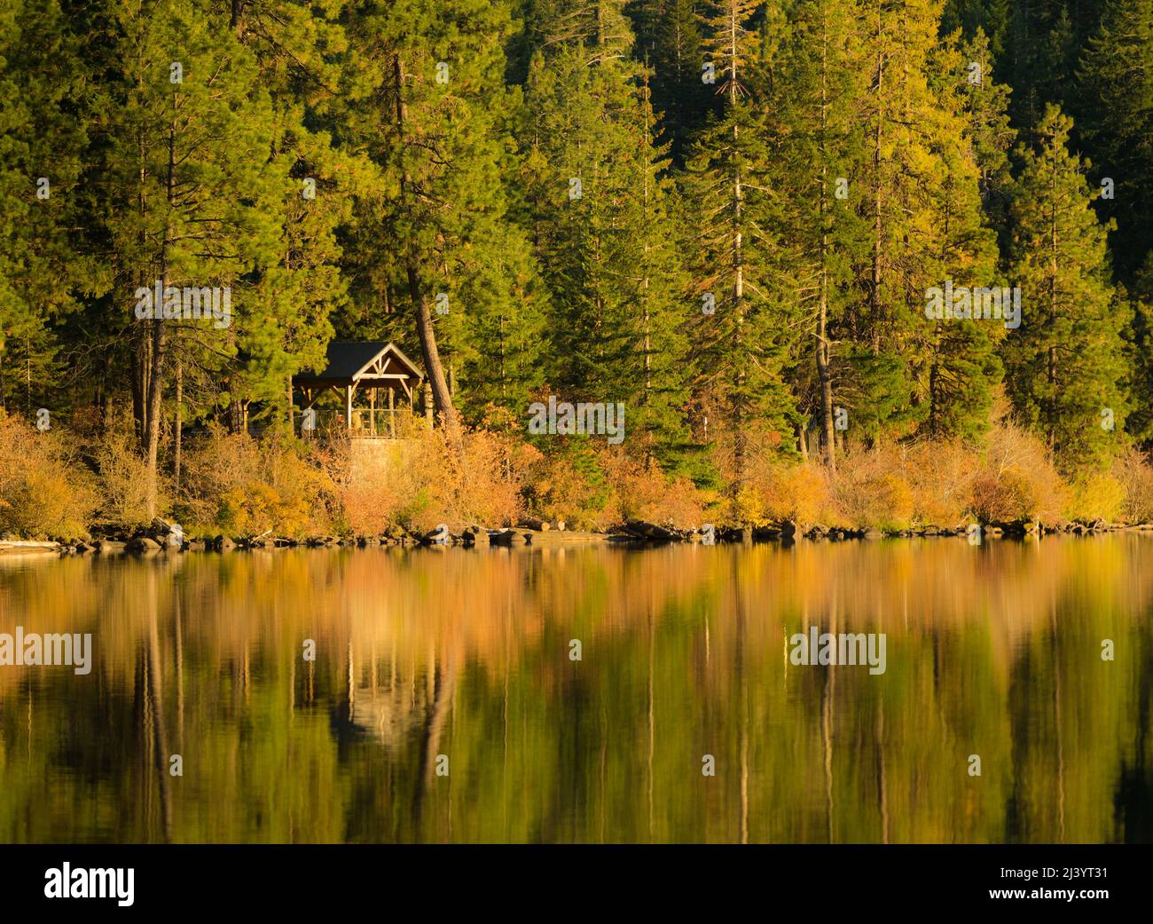 A lakeside gazebo on Suttle Lake, Oregon during a fall evening. Stock Photo