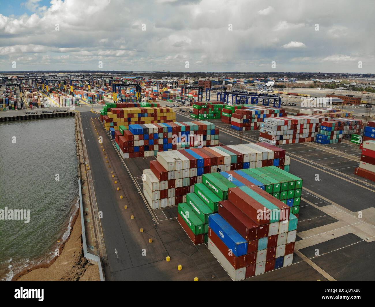Stacks of shipping containers are stored in the port of Felixstowe ...